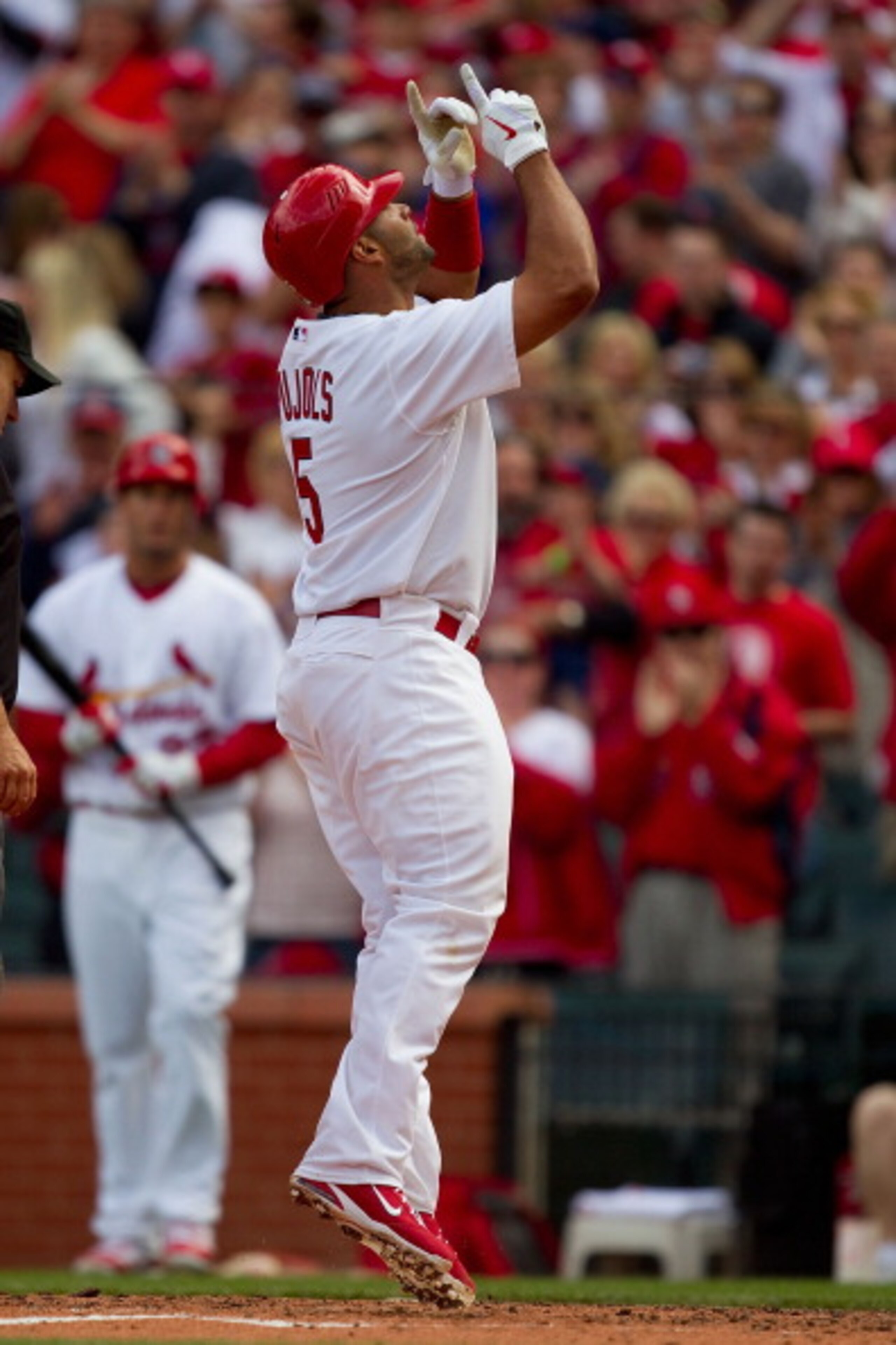 ST. LOUIS, MO - APRIL 2: Albert Pujols #5 of the St. Louis Cardinals celebrates a home run against the San Diego Padres at Busch Stadium on April 2, 2011 in St. Louis, Missouri.  (Photo by Dilip Vishwanat/Getty Images)