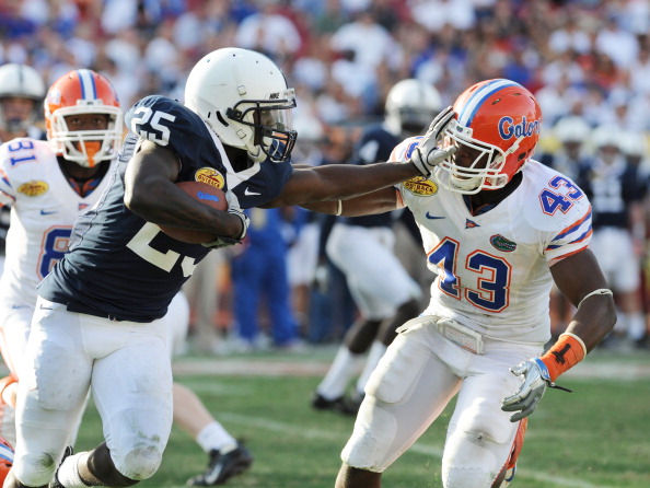 TAMPA, FL - JANUARY 1:  Running back Evan Royster #22 of the Penn State Nittany Lions pushed off linebacker Jelani Jenkins #43 of  the Florida Gators January 1, 2010 in the 25th Outback Bowl at Raymond James Stadium in Tampa, Florida.  (Photo by Al Messer