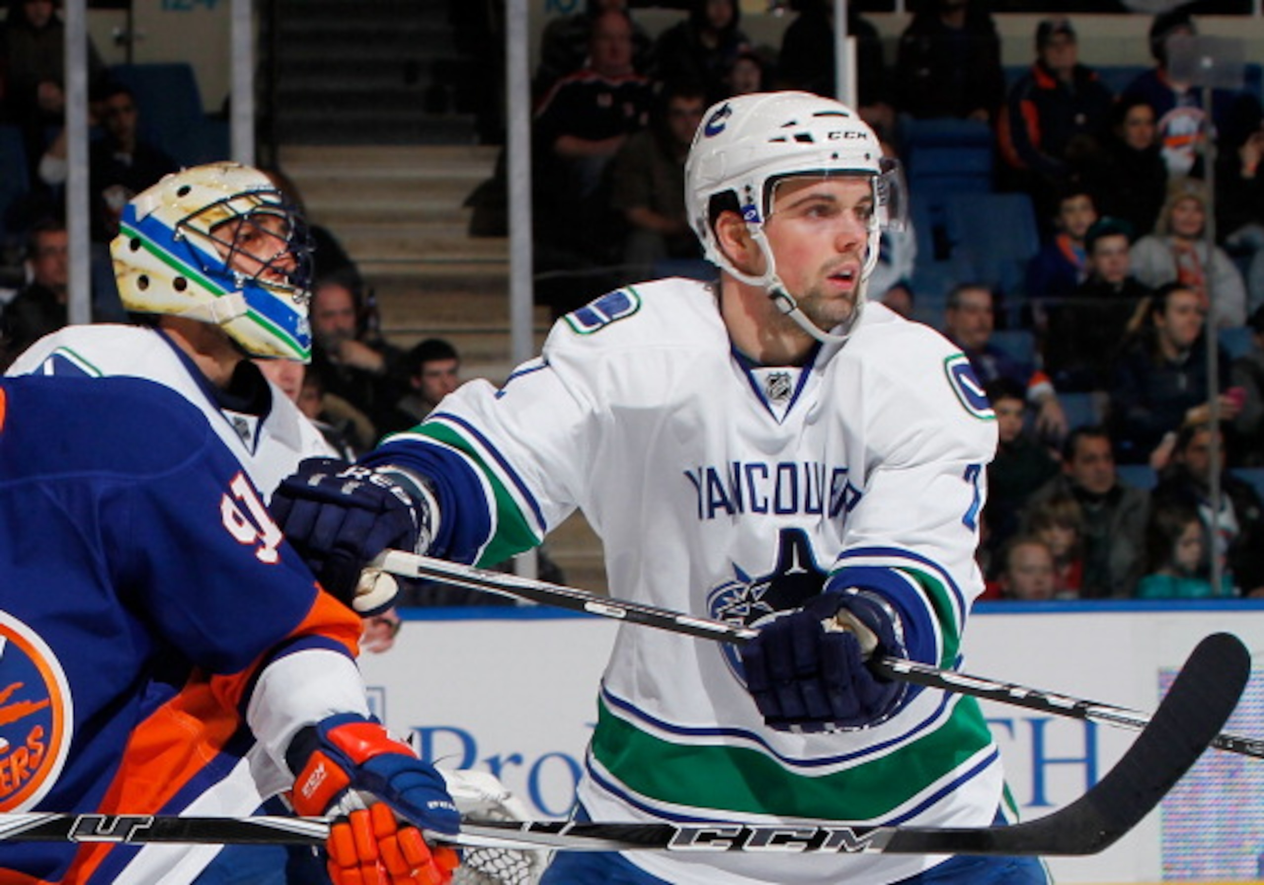 UNIONDALE, NY - JANUARY 11: Dan Hamhuis #2 of the Vancouver Canucks throws a check during an NHL game against the New York Islanders at Nassau Coliseum on January 11, 2011 in Uniondale, New York. (Photo by Paul Bereswill/Getty Images) UNIONDALE, NY - JANUARY 11: Dan Hamhuis #2 of the Vancouver Canucks throws a check during an NHL game against the New York Islanders at Nassau Coliseum on January 11, 2011 in Uniondale, New York. (Photo by Paul Bereswill/Getty Images)