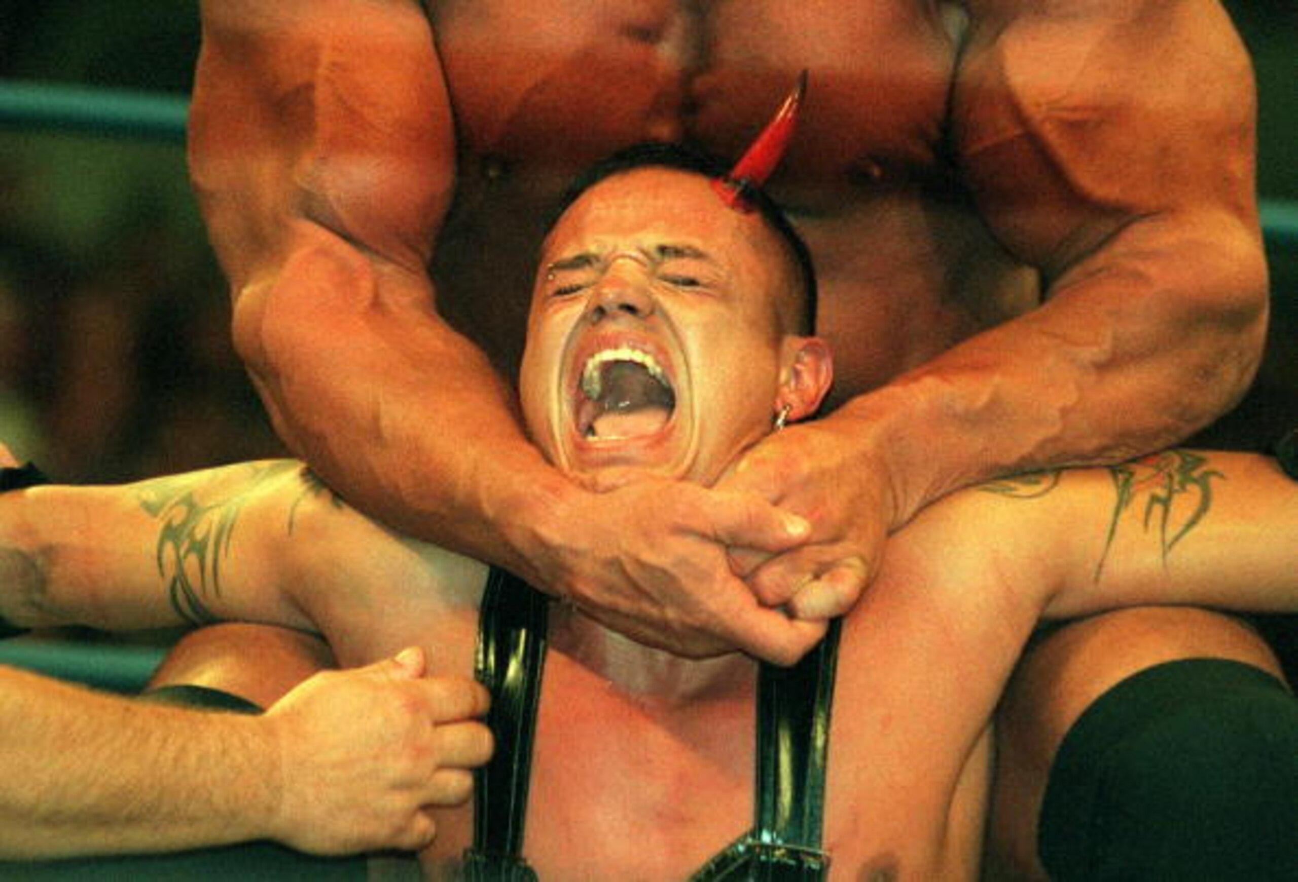 09 Oct 2000:  Ray Mysterio Jr is strangled by Scott Steiner during their bout at the World Chamionship Wrestling ''Thunder Down Under'' night at the Sydney Entertainment Centre, Sydney, Australia. Mandatory Credit: Scott Barbour/ALLSPORT