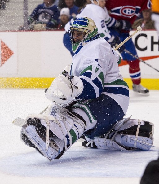 VANCOUVER, CANADA - FEBRUARY 22: Goalie Roberto Luongo #1 of the Vancouver Canucks makes a glove save against the Montreal Canadiens during the first period in NHL action on February 22, 2011 at Rogers Arena in Vancouver, British Columbia, Canada.  (Photo