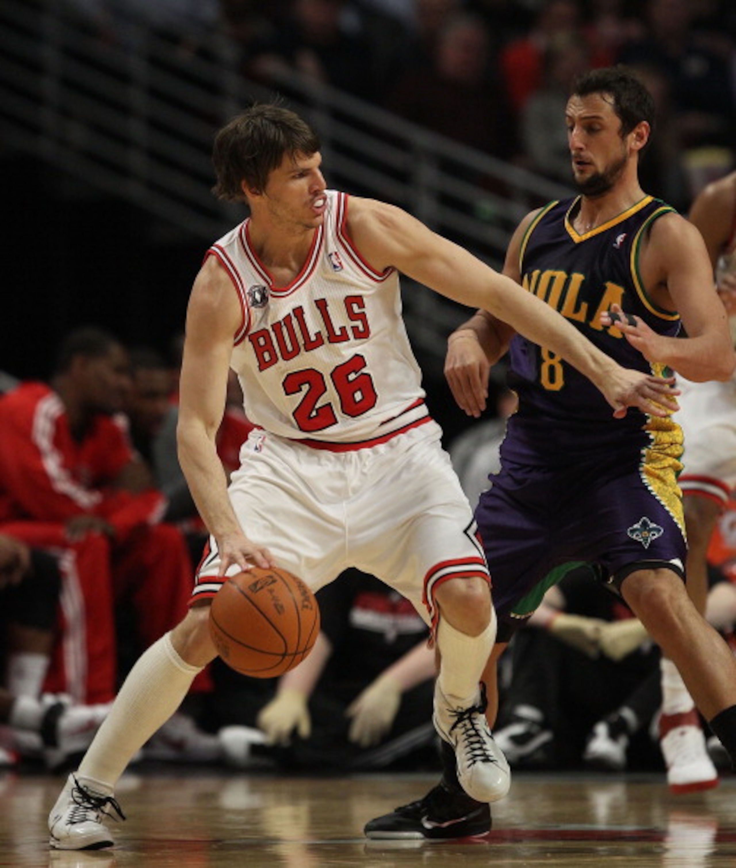 CHICAGO, IL - MARCH 07: Kyle Korver #26 of the Chicago Bulls moves against Marco Belinelli  #8 of the New Orleans Hornets at the United Center on March 7, 2011 in Chicago, Illinois. The Bulls defeated the Hornets 85-77. NOTE TO USER: User expressly acknow