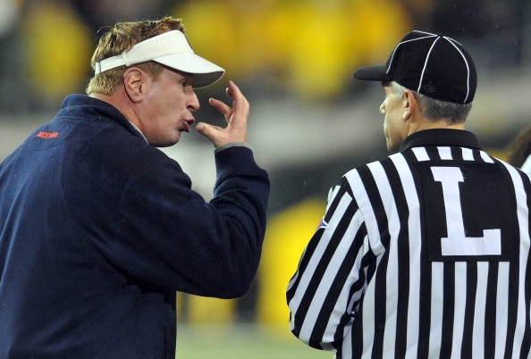 EUGENE, OR - NOVEMBER 26: Head coach Mike Stoops of the Arizona Wildcats has some words with head linesman Cappy Anderson in the second quarter of the game against the Oregon Ducks at Autzen Stadium on November 26, 2010 in Eugene, Oregon.The Ducks won the