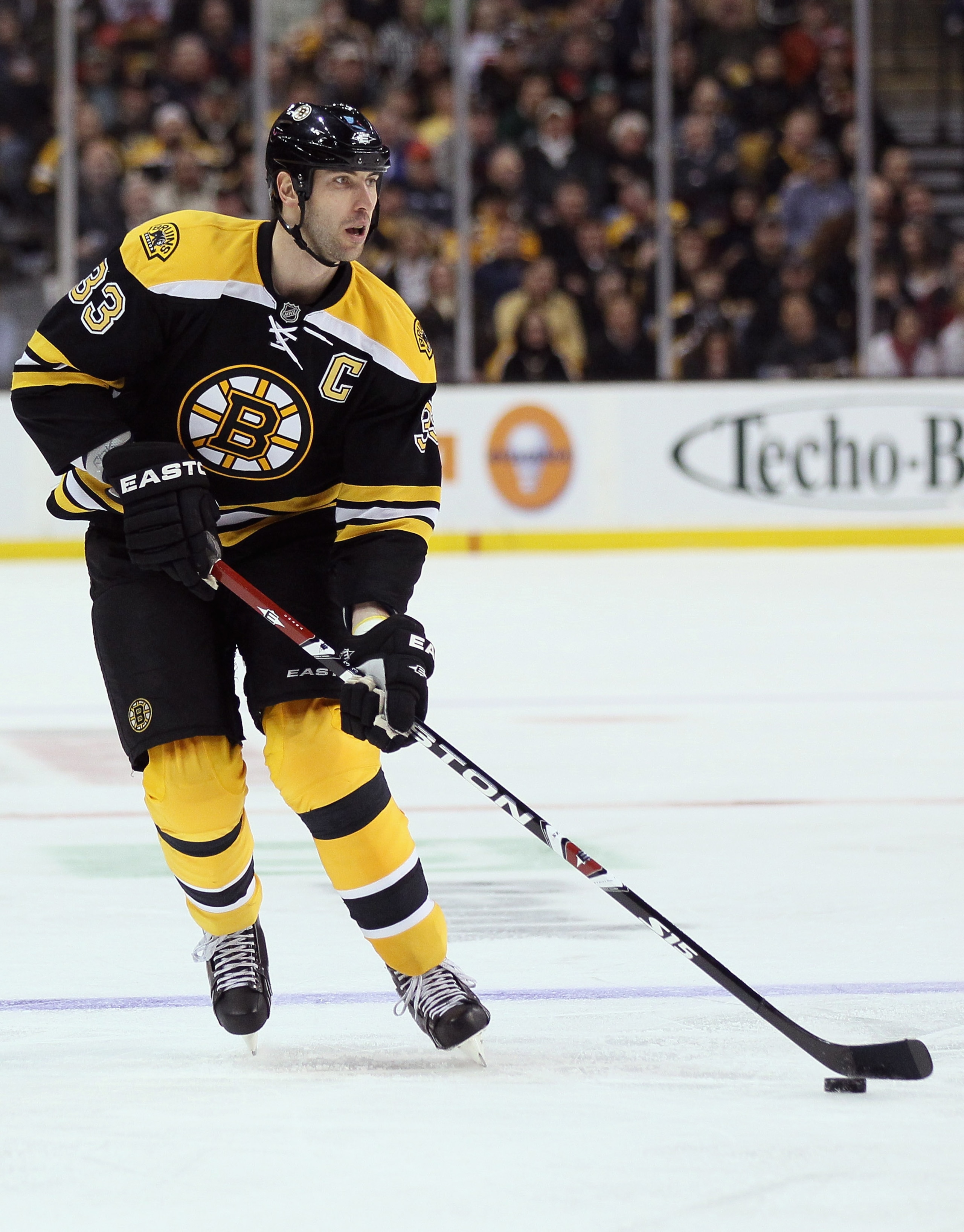 BOSTON, MA - MARCH 24:  Zdeno Chara #33 of the Boston Bruins takes the puck in the third period against the Montreal Canadiens on March 24, 2011 at the TD Garden in Boston, Massachusetts.  The Boston Bruins defeated the Montreal Canadiens 7-0.  (Photo by