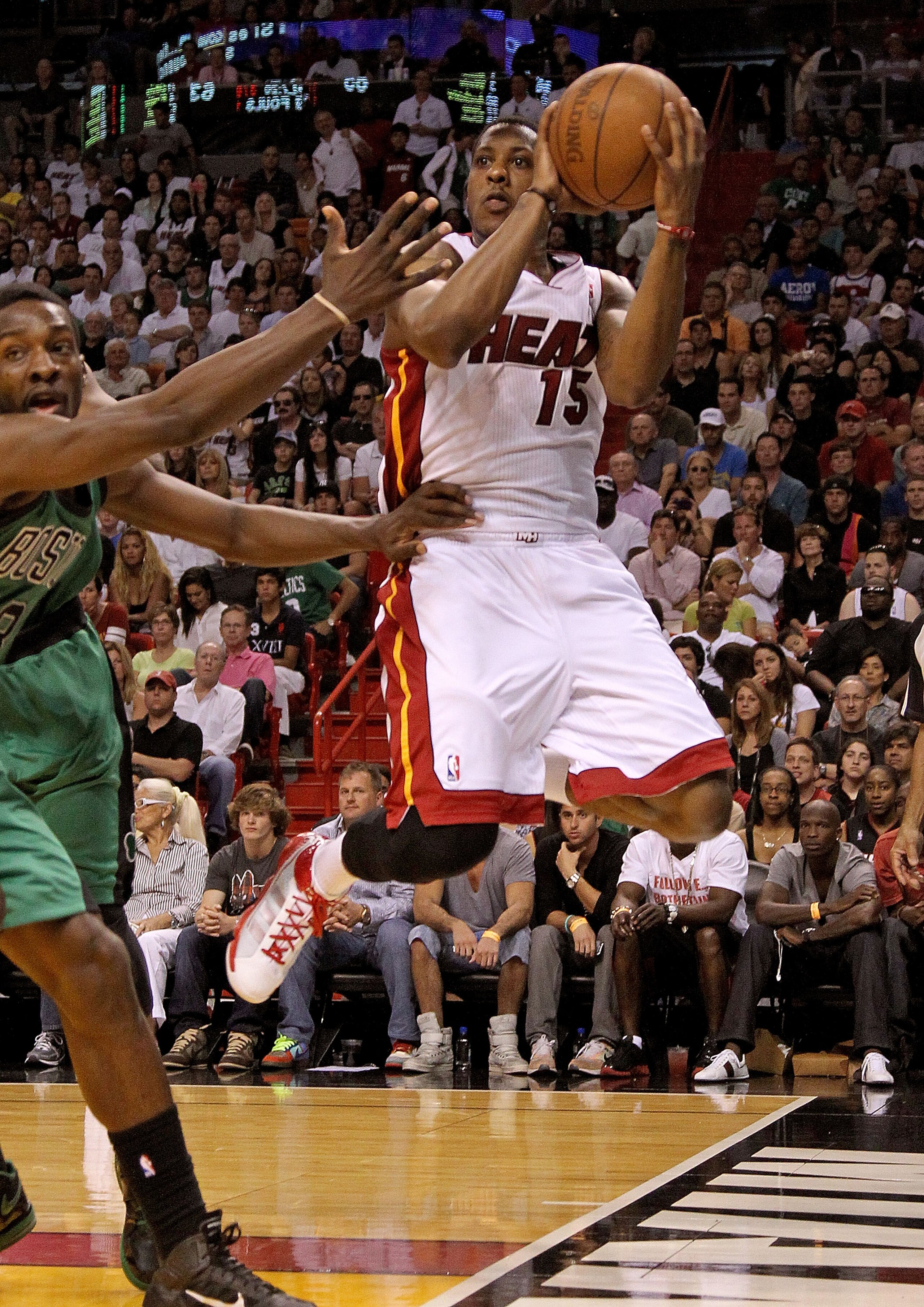 MIAMI, FL - APRIL 10:  Mario Chalmers #15 of the Miami Heat looks to pass during a game against the Boston Celtics at American Airlines Arena on April 10, 2011 in Miami, Florida. NOTE TO USER: User expressly acknowledges and agrees that, by downloading an