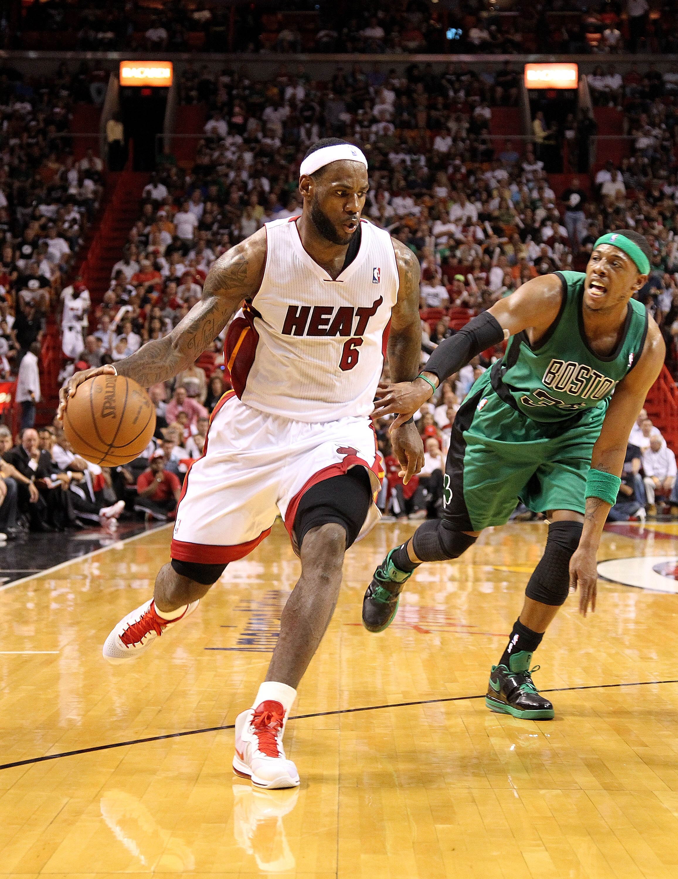 MIAMI, FL - APRIL 10:  LeBron James #6 of the Miami Heat posts up Paul Pierce #34 of the Boston Celtics during a game  at American Airlines Arena on April 10, 2011 in Miami, Florida. NOTE TO USER: User expressly acknowledges and agrees that, by downloadin