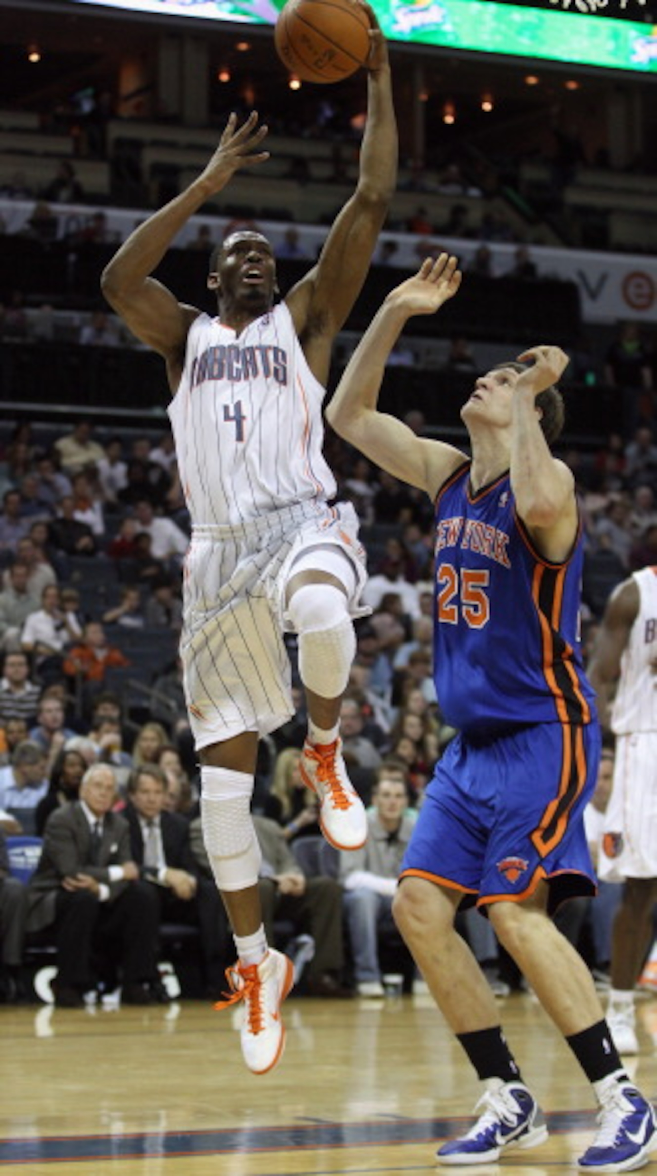 CHARLOTTE, NC - NOVEMBER 24:  Timofey Mozgov #25 of the New York Knicks tries to stop Derrick Brown #4 of the Charlotte Bobcats during their game at Time Warner Cable Arena on November 24, 2010 in Charlotte, North Carolina.  NOTE TO USER: User expressly a