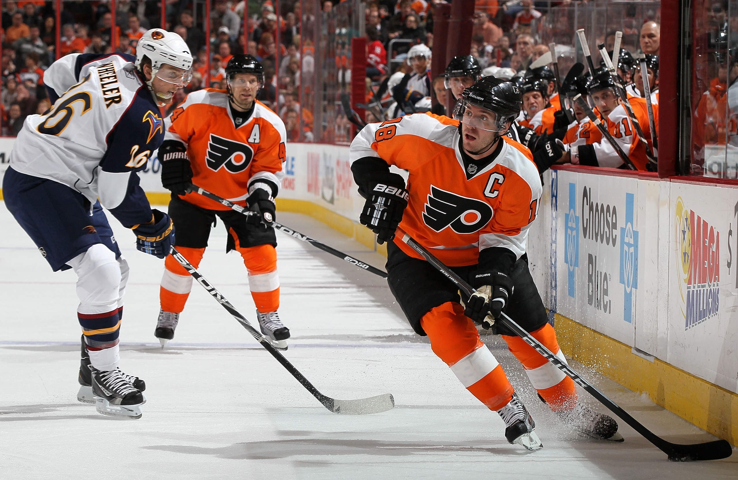 PHILADELPHIA, PA - MARCH 12:  Mike Richards #18 of the Philadelphia Flyers controls the puck against Blake Wheeler #26 of the Atlanta Thrashers on March 12, 2011 at Wells Fargo Center in Philadelphia, Pennsylvania. The Thrashers defeated the Flyers 5-4  i