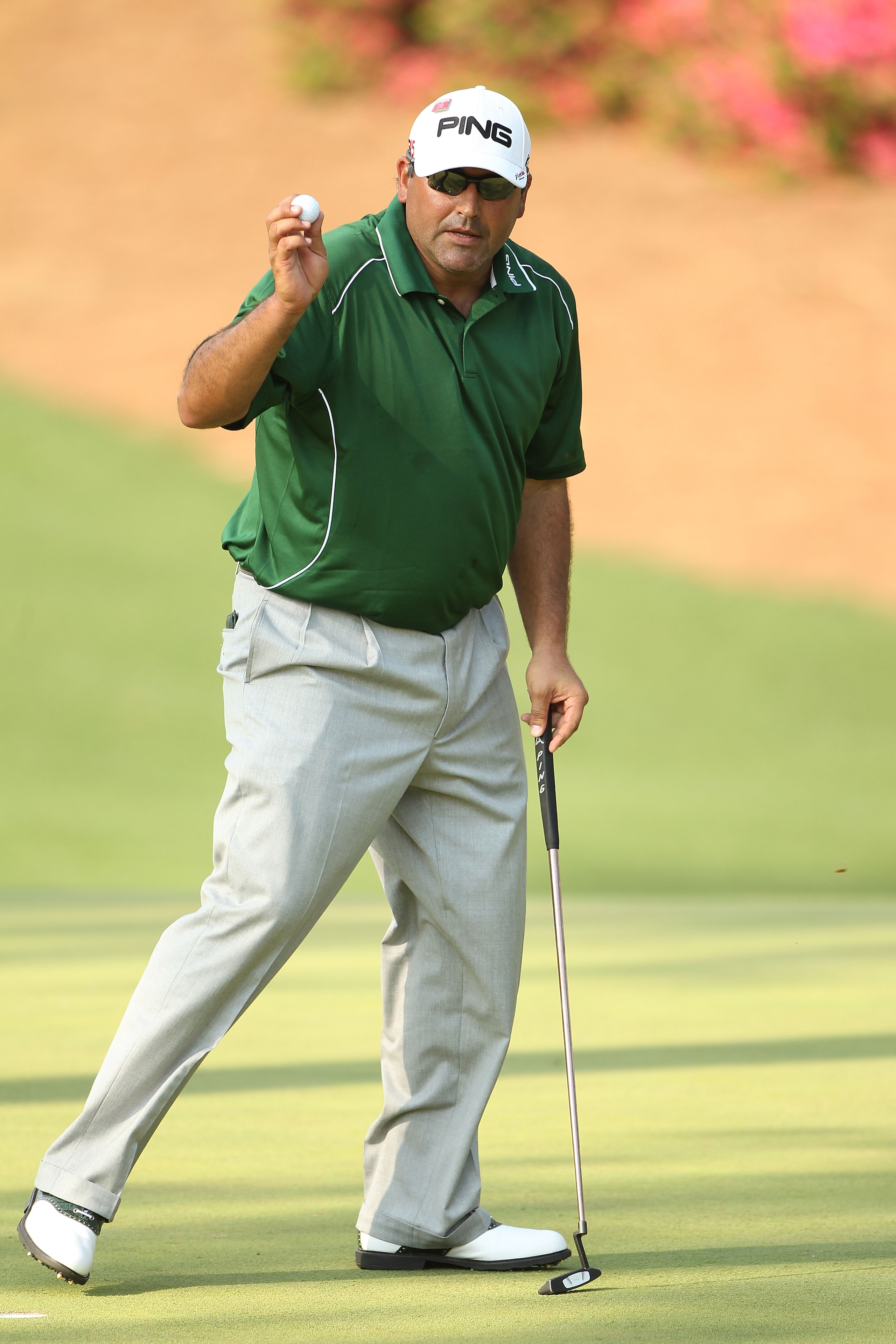 AUGUSTA, GA - APRIL 10:  Angel Cabrera of Argentina waves to the gallery on the tenth green during the final round of the 2011 Masters Tournament at Augusta National Golf Club on April 10, 2011 in Augusta, Georgia.  (Photo by Andrew Redington/Getty Images