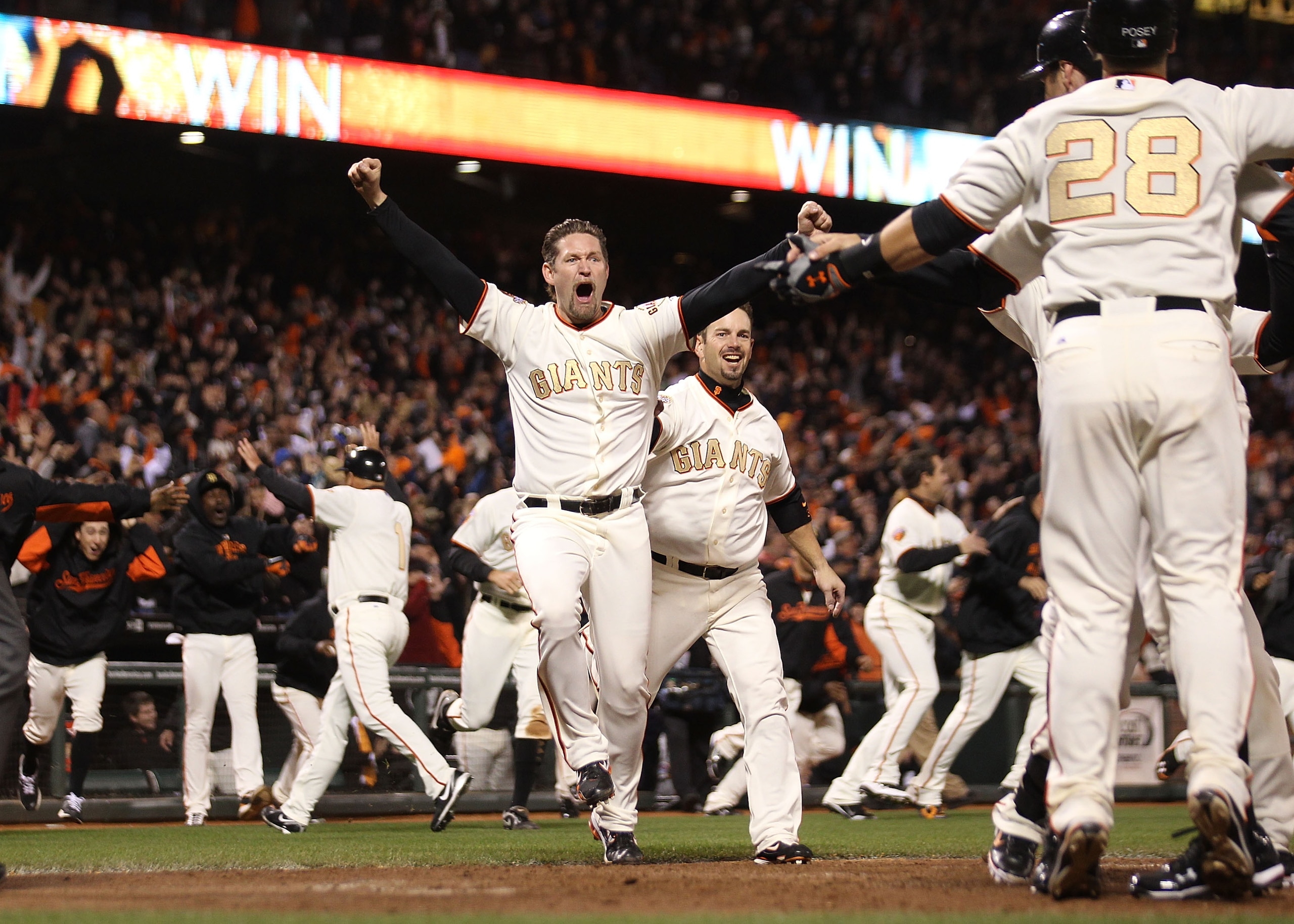 SAN FRANCISCO, CA - APRIL 09:  Aubrey Huff #17 celebrates after Miguel Tejada of the San Francisco Giants hit the game winning hit in the ninth inning against the St. Louis Cardinals at AT&T Park on April 9, 2011 in San Francisco, California.  (Photo by J
