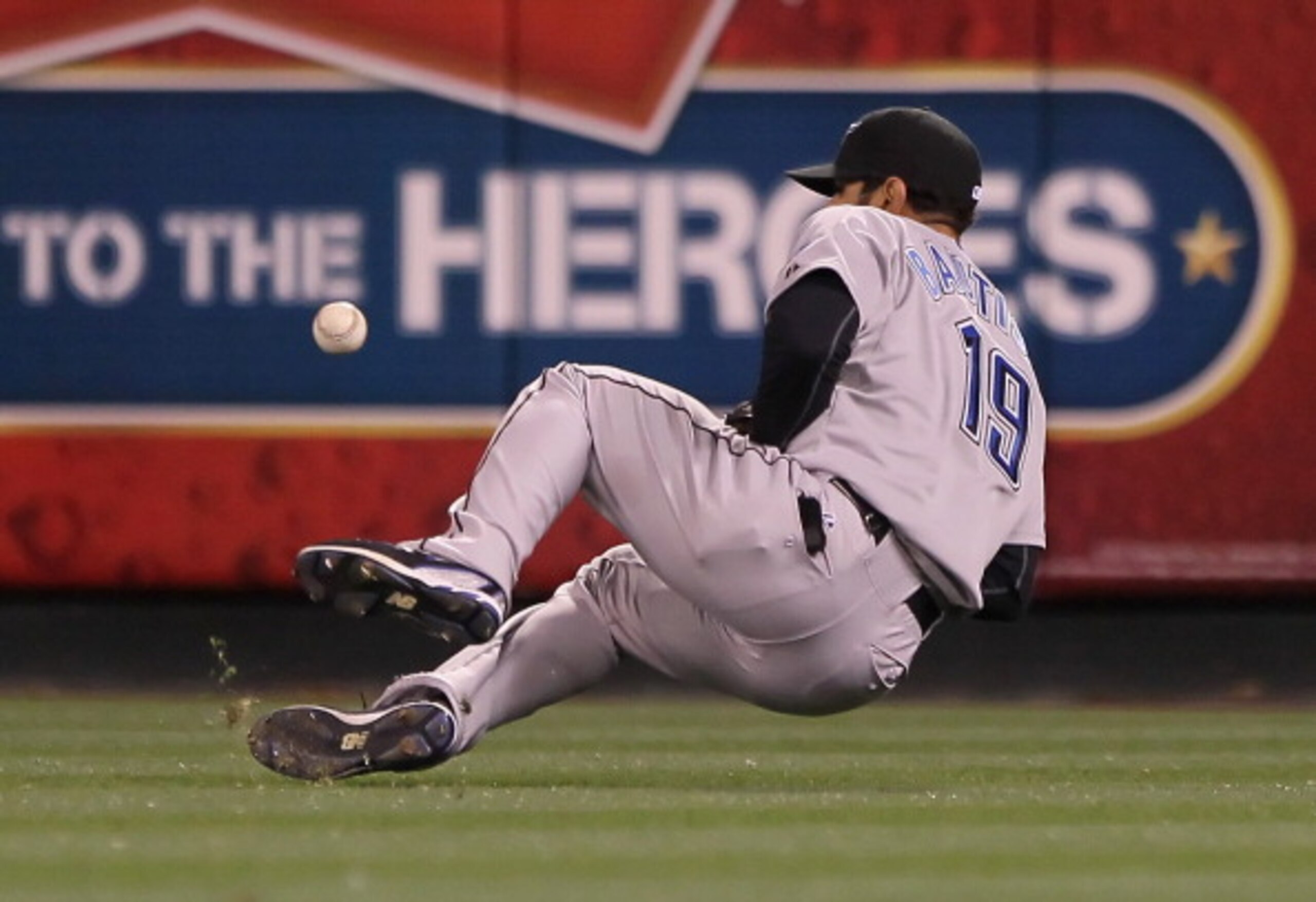ANAHEIM, CA - APRIL 08:  Right fielder Jose Bautista #19 of the Toronto Blue Jays can't control a ball hit by Howard Kendrick of the Los Angeles Angels of Anaheim in the third inning at Angel Stadium of Anaheim on April 8, 2011 in Anaheim, California.  (P
