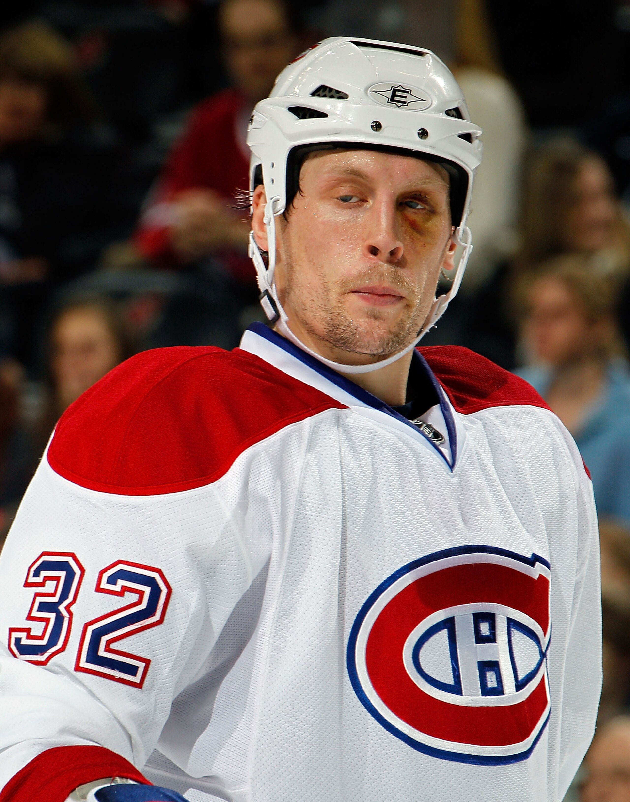 NEWARK, NJ - APRIL 02:  Travis Moen #32 of the Montreal Canadians wears a black eye as he waits for a faceoff during an NHL hockey game against the New Jersey Devils at the Prudential Center on April 2, 2011 in Newark, New Jersey.  (Photo by Paul Bereswil