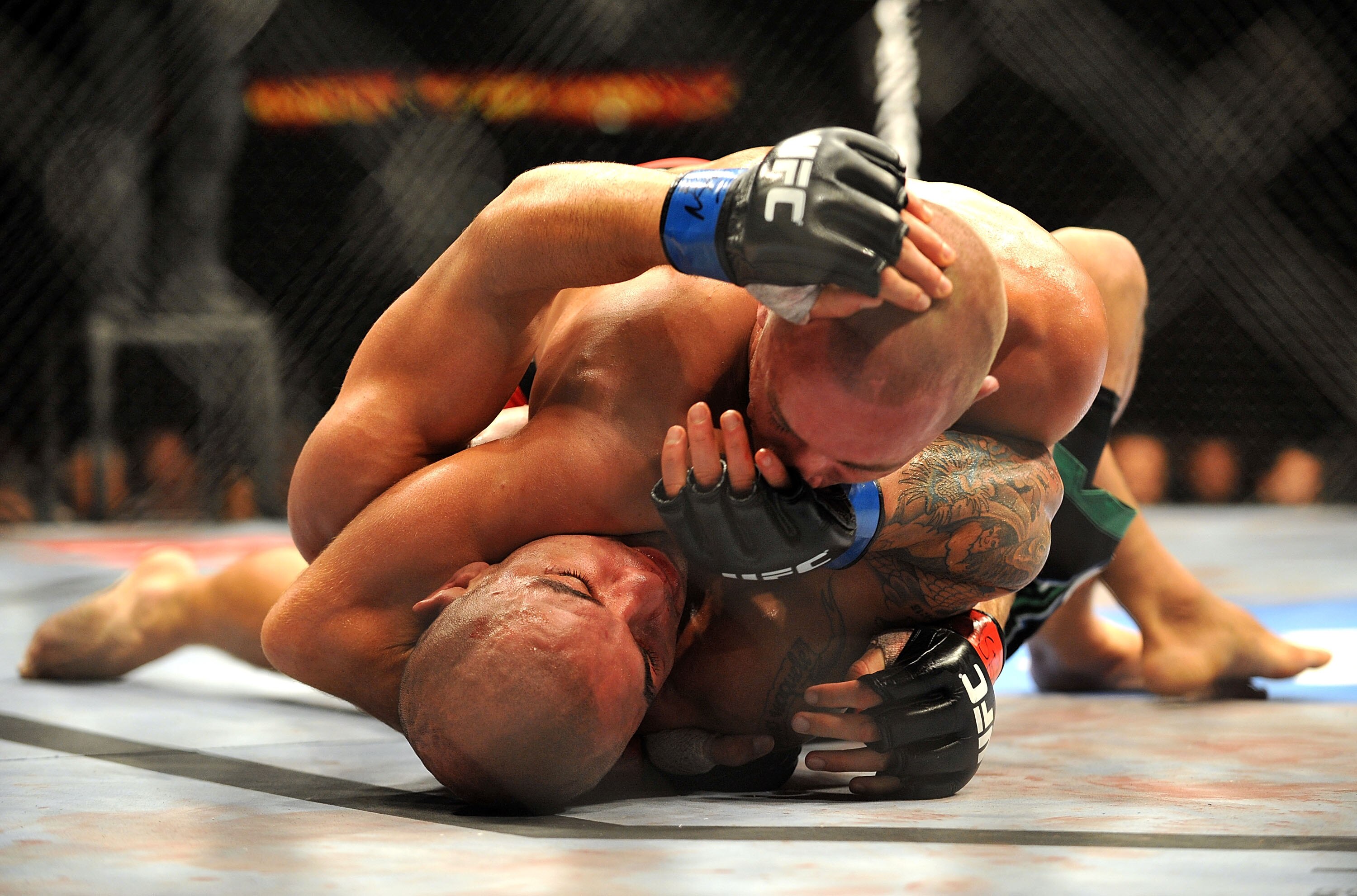 LAS VEGAS - JULY 11:  (Top) Georges St. Pierre battles Thiago Alves during their welterweight title bout during UFC 100 on July 11, 2009 in Las Vegas, Nevada.  (Photo by Jon Kopaloff/Getty Images)