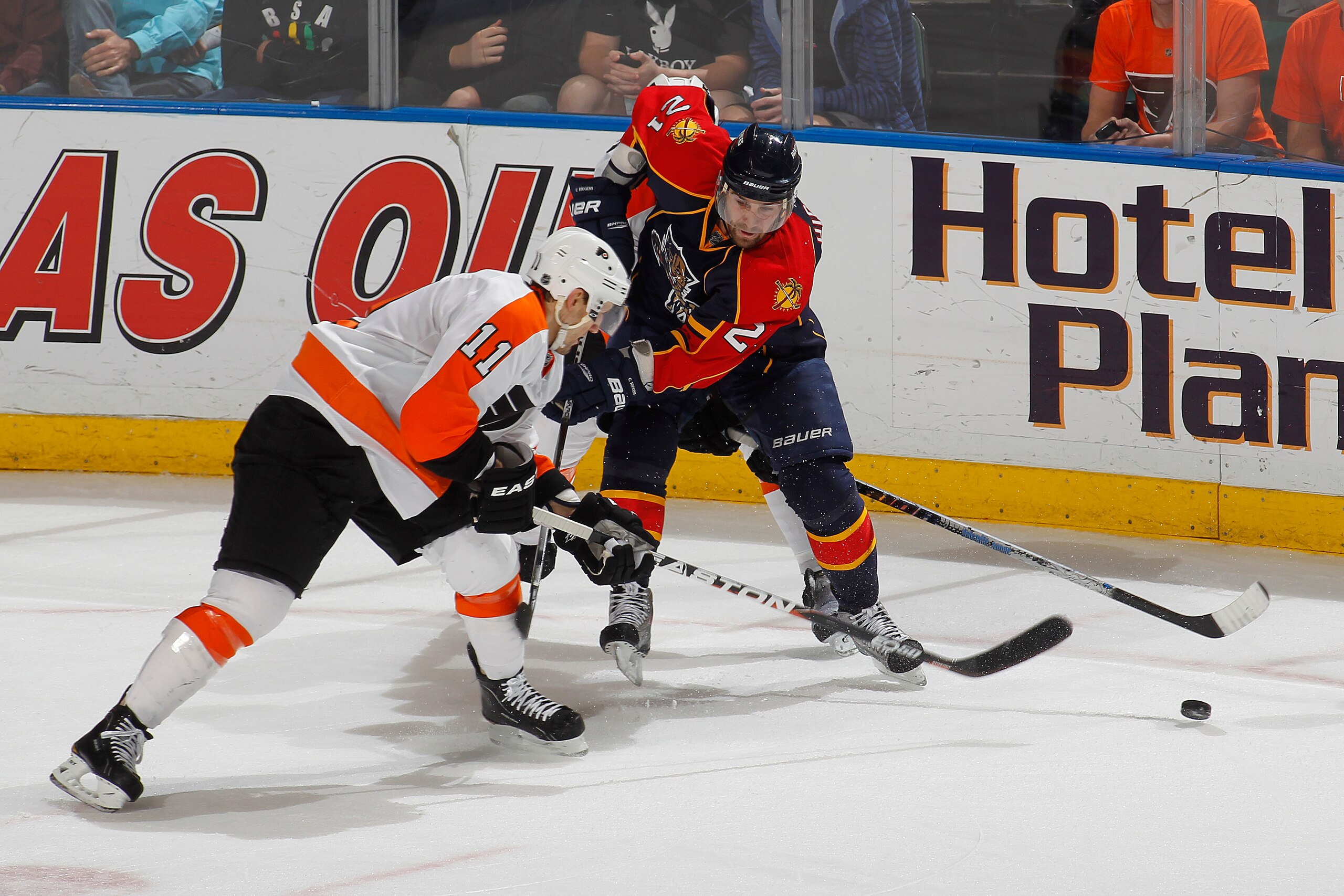 SUNRISE, FL - FEBRUARY 16: Blair Betts #11 of the Philadelphia Flyers checks the puck away from Christopher Higgins #21 of the Florida Panthers on February 16, 2011 at the BankAtlantic Center in Sunrise, Florida. The Flyers defeated the Panthers 4-2. (Pho