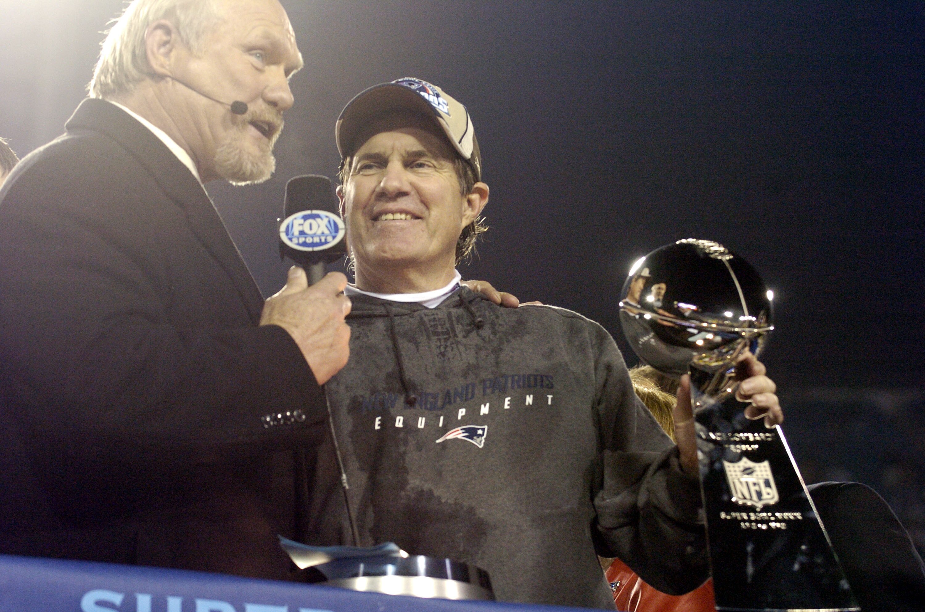 New England Patriots Head Coach Bill Belichick holds The Vince Lombardi Trophy after the Patriots won Super Bowl XXXIX at Alltel Stadium in Jacksonville, Florida on February 6, 2005.  (Photo by Al Messerschmidt/Getty Images)