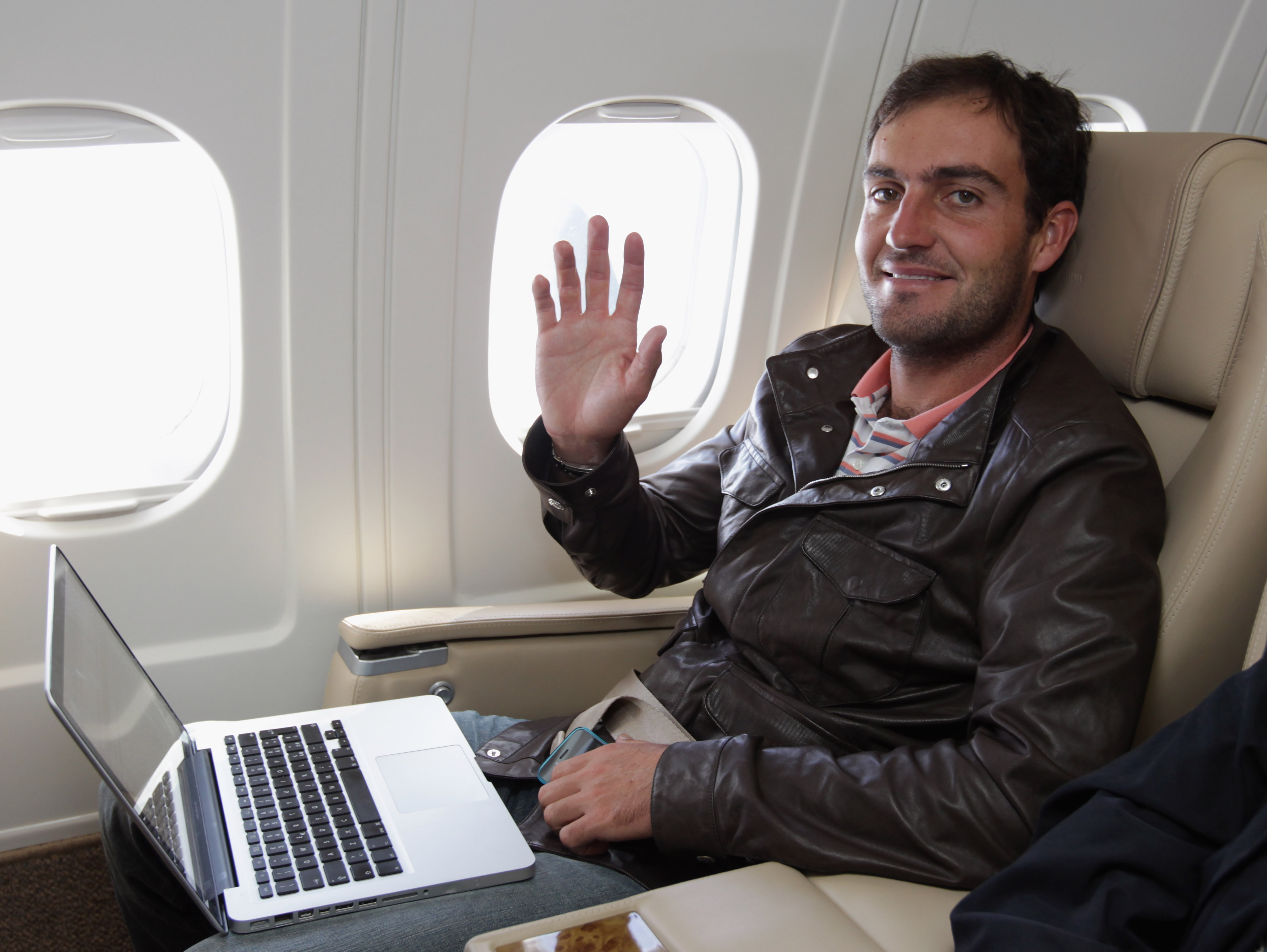 CARDIFF, UNITED KINGDOM - OCTOBER 05:  Edoardo Molinari of Italy works on his computer in a private jet as he flies from Cardiff airport on October 5, 2010 in Cardiff, United Kingdom. Molinari was a member of the winning European team at The Ryder Cup and
