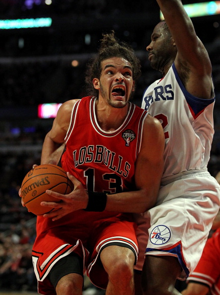 CHICAGO, IL - MARCH 28: Joakim Noah #13 of the Chicago Bulls moves against Elton Brand #42 of the Philadelphia 76ers at the United Center on March 28, 2011 in Chicago, Illinois. The 76ers defeated the Bulls 97-85. NOTE TO USER: User expressly acknowledges