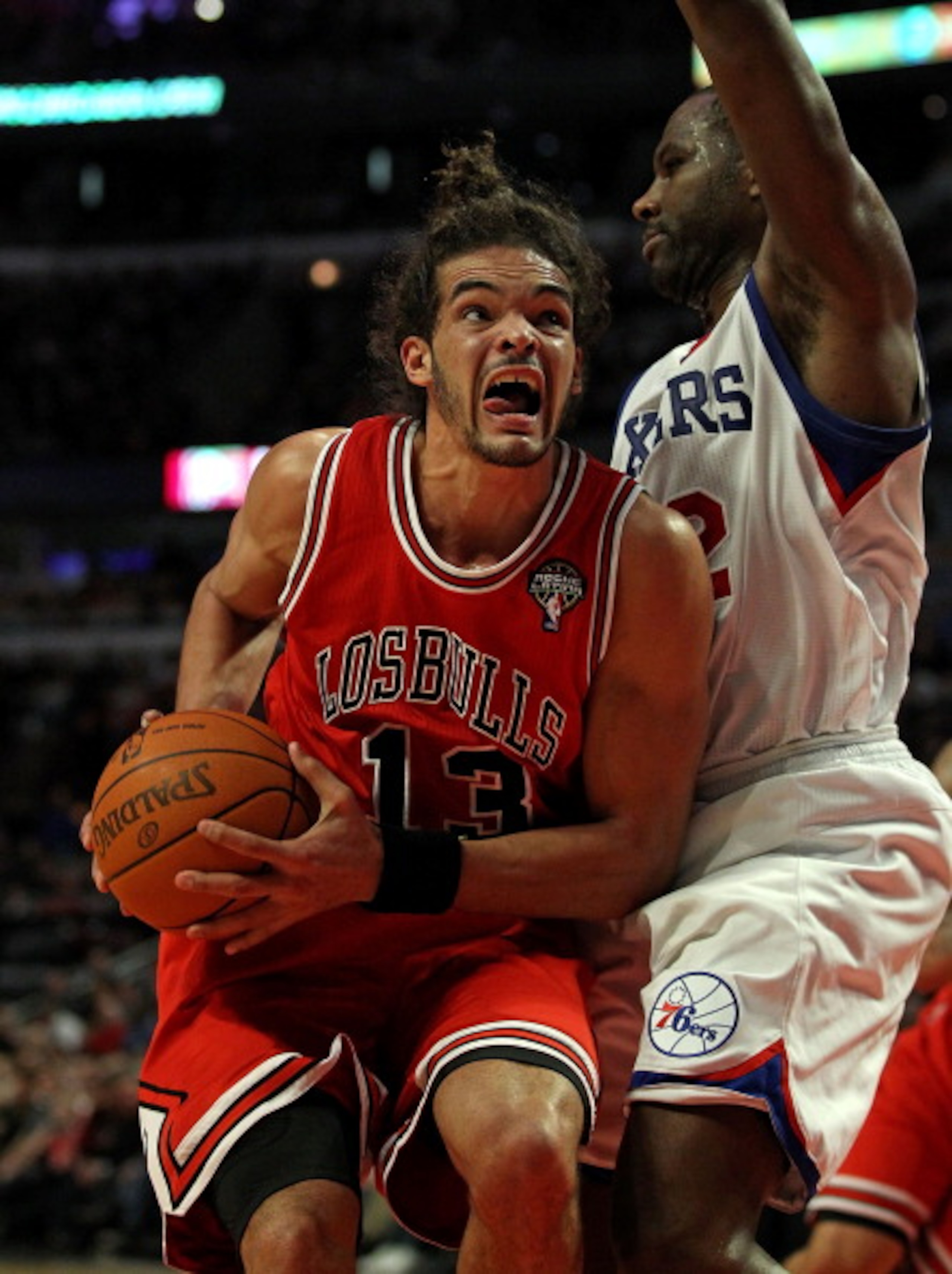 CHICAGO, IL - MARCH 28: Joakim Noah #13 of the Chicago Bulls moves against Elton Brand #42 of the Philadelphia 76ers at the United Center on March 28, 2011 in Chicago, Illinois. The 76ers defeated the Bulls 97-85. NOTE TO USER: User expressly acknowledges