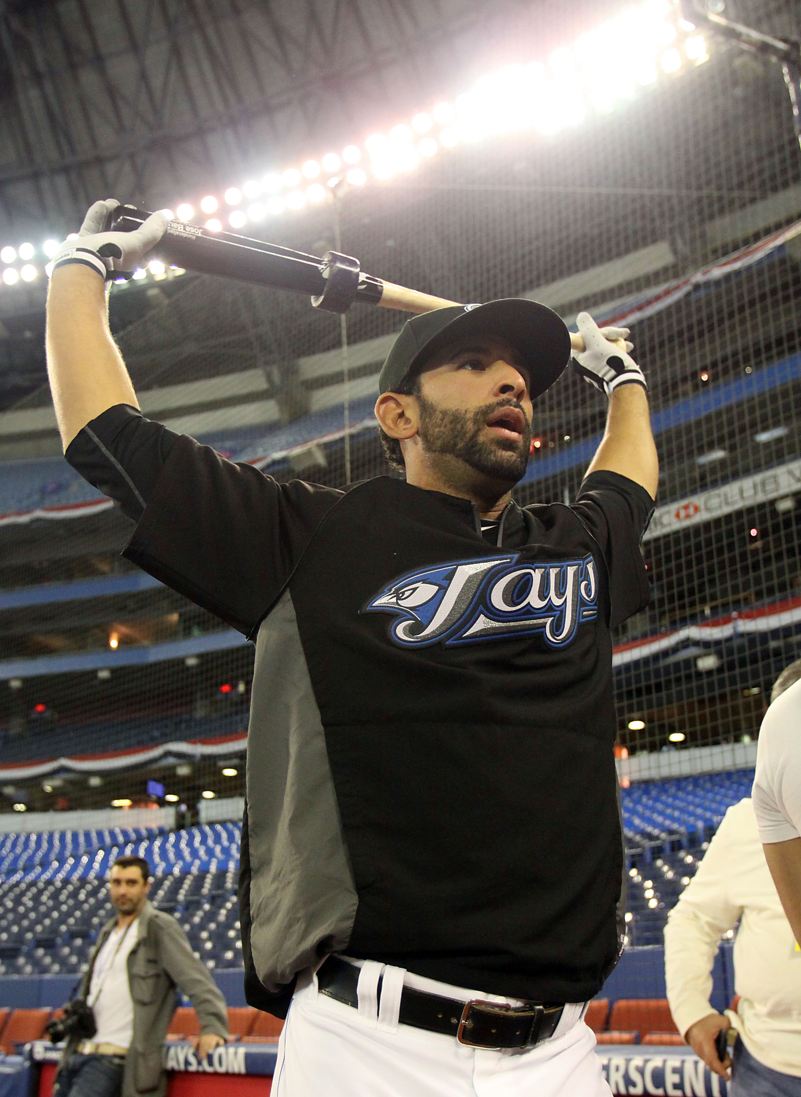 TORONTO,CANADA - APRIL 1:  Jose Bautista #19 of the Toronto Blue Jays stretches prior to the home opener for the Toronto Blue Jays as they face the Minnesota Twins during their MLB game at the Rogers Centre April 1, 2011 in Toronto, Ontario, Canada.(Photo