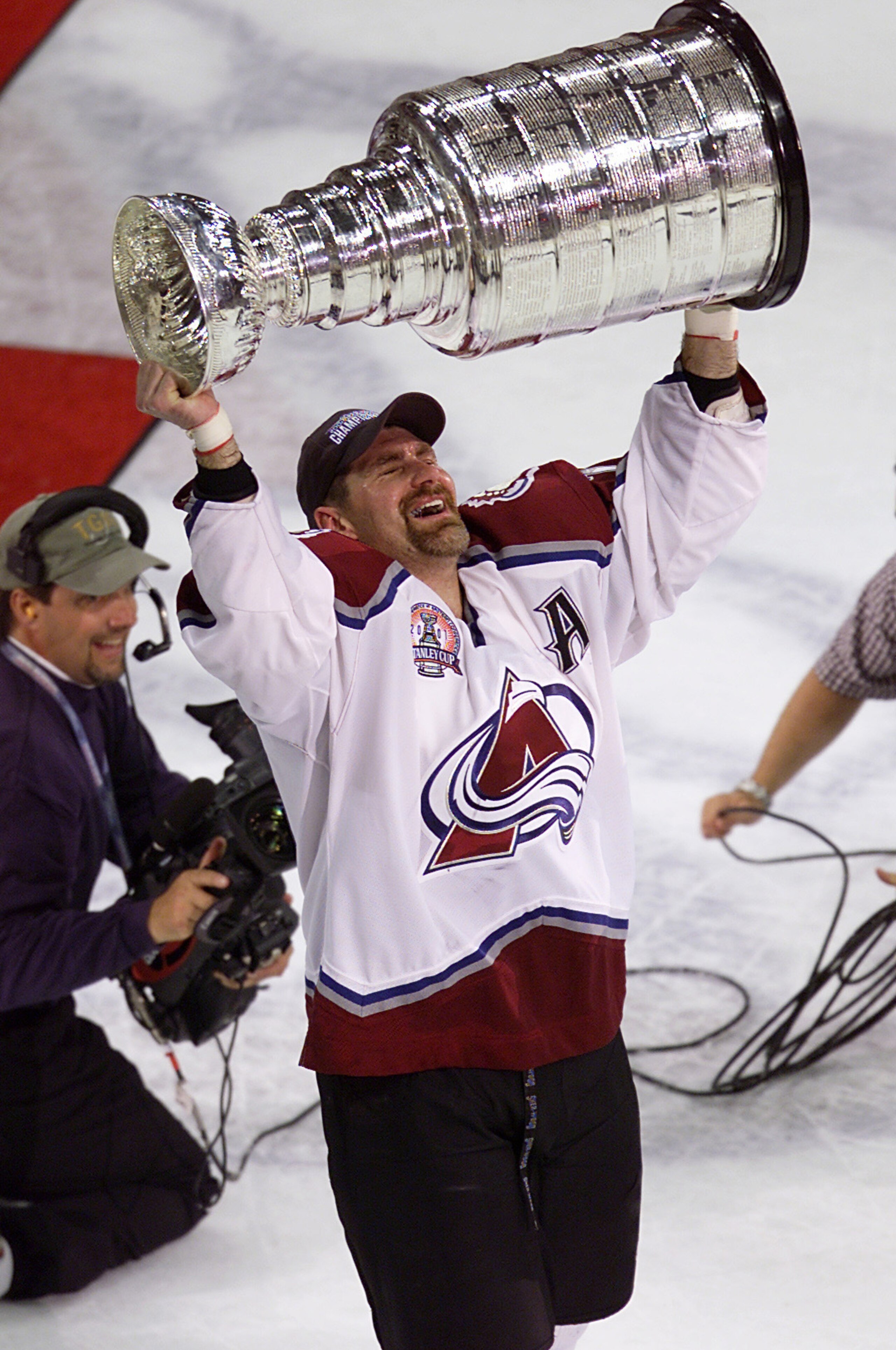 9 Jun 2001:  Ray Bourque #77 of the Colorado Avalanche skates away with the Stanley Cup after 22 seasons in pursuit of the NHL Stanley Cup Championship. Denver, Colorado.  DIGITAL IMAGE.  Mandatory Credit: Brian Bahr/ALLSPORT