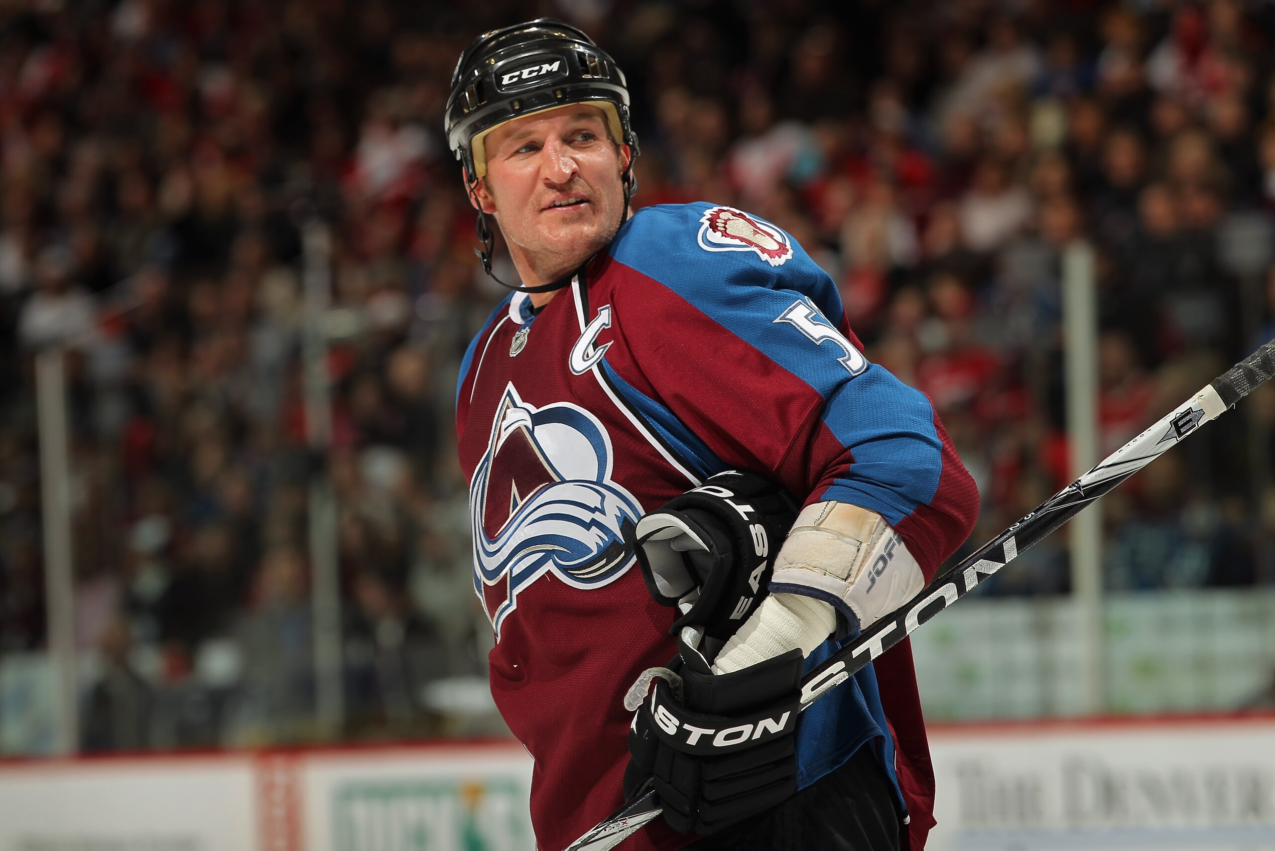 DENVER, CO - JANUARY 10:  Adam Foote #52 of the Colorado Avalanche looks on during a break in the action against the Detroit Red Wings at the Pepsi Center on January 10, 2011 in Denver, Colorado. The Avalanche defeated the Red Wings 5-4.  (Photo by Doug P