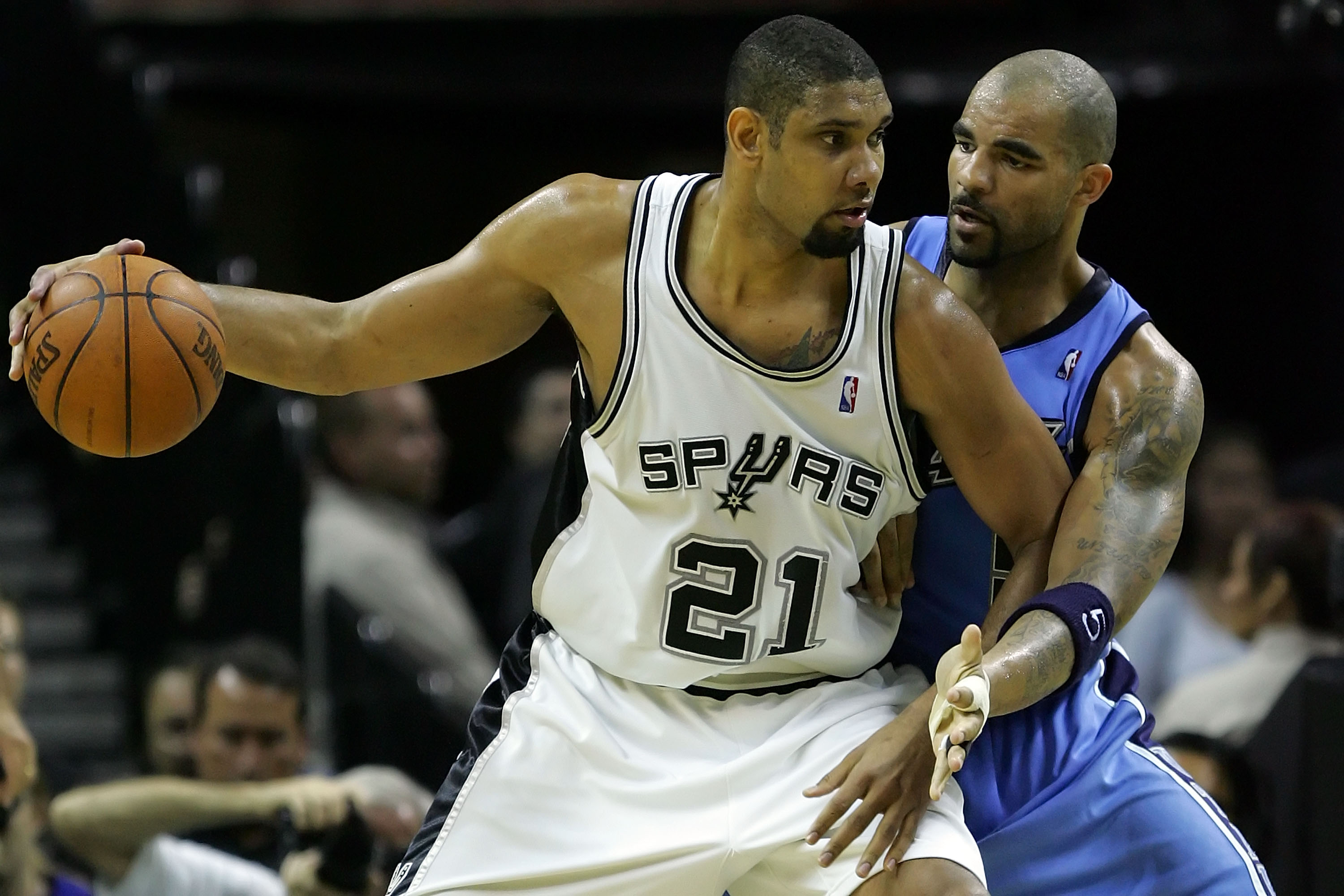 SAN ANTONIO - MAY 30:  Tim Duncan #21 of the San Antonio Spurs posts up Carlos Boozer #5 of the Utah Jazz in the second quarter during Game Five of the Western Conference Finals during the 2007 NBA Playoffs at AT&T Center on May 30, 2007 in San Antonio, T