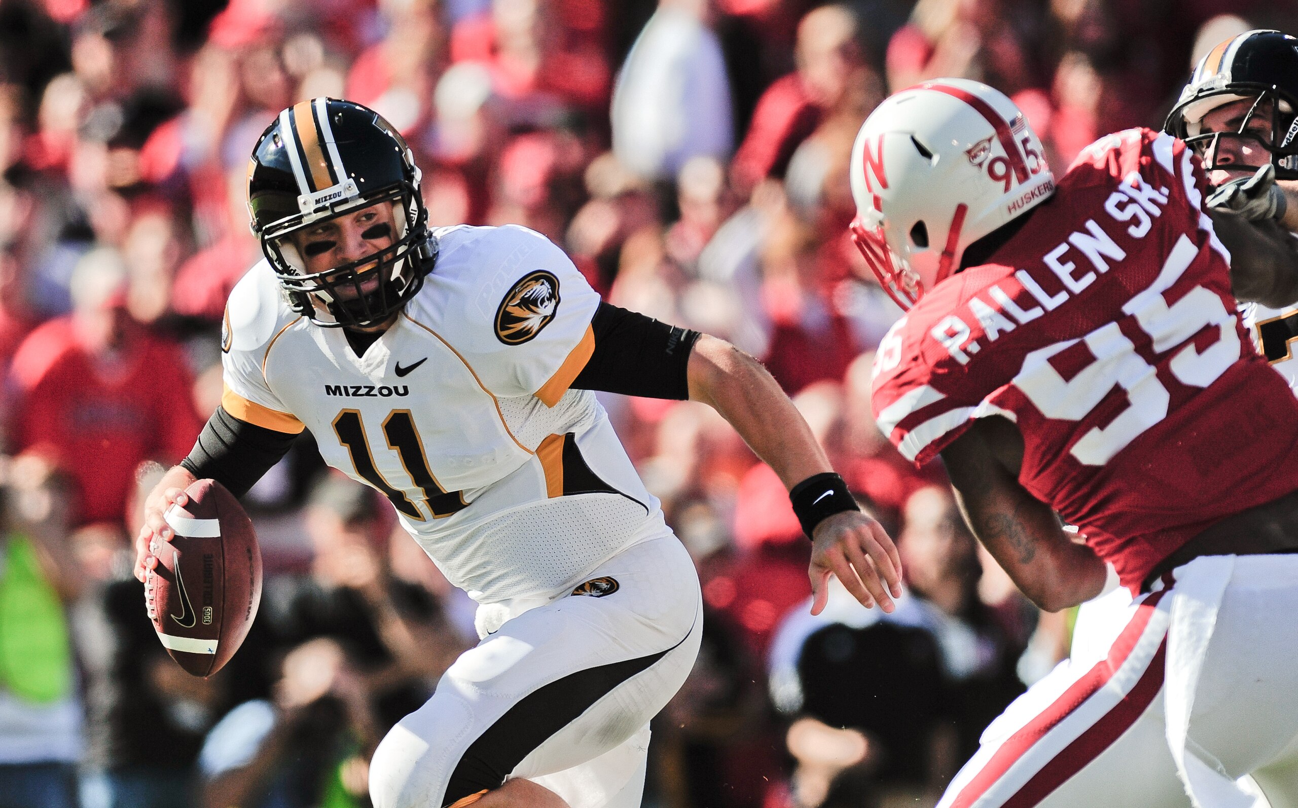 LINCOLN, NE - OCTOBER 30: Quarterback Blaine Gabbert #11 of the Missouri Tigers tries to avoid defensive end Pierre Allen #95 of the Nebraska Cornhuskers during first half action of their game at Memorial Stadium on October 30, 2010 in Lincoln, Nebraska.