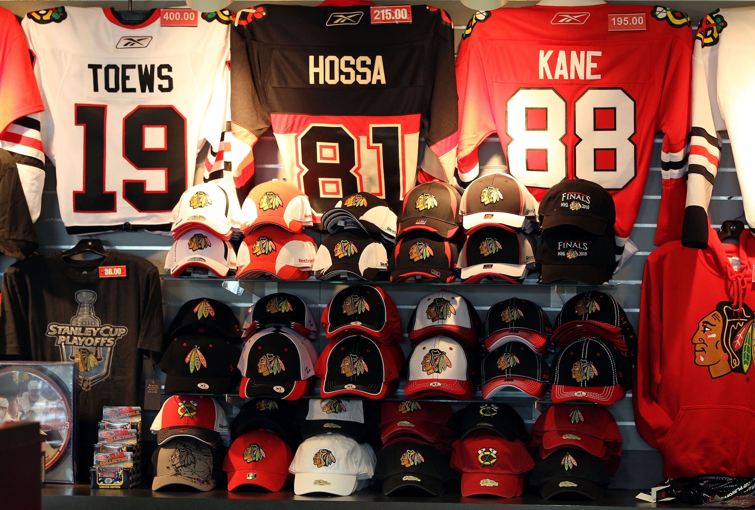 CHICAGO - MAY 21: Chicago Blackhawks hats and sweaters are shown in a both for sale before the start of Game Three of the Western Conference Finals during the 2010 NHL Stanley Cup Playoffs between the Blackhawks and the San Jose Sharks at the United Cent CHICAGO - MAY 21: Chicago Blackhawks hats and sweaters are shown in a both for sale before the start of Game Three of the Western Conference Finals during the 2010 NHL Stanley Cup Playoffs between the Blackhawks and the San Jose Sharks at the United Cent