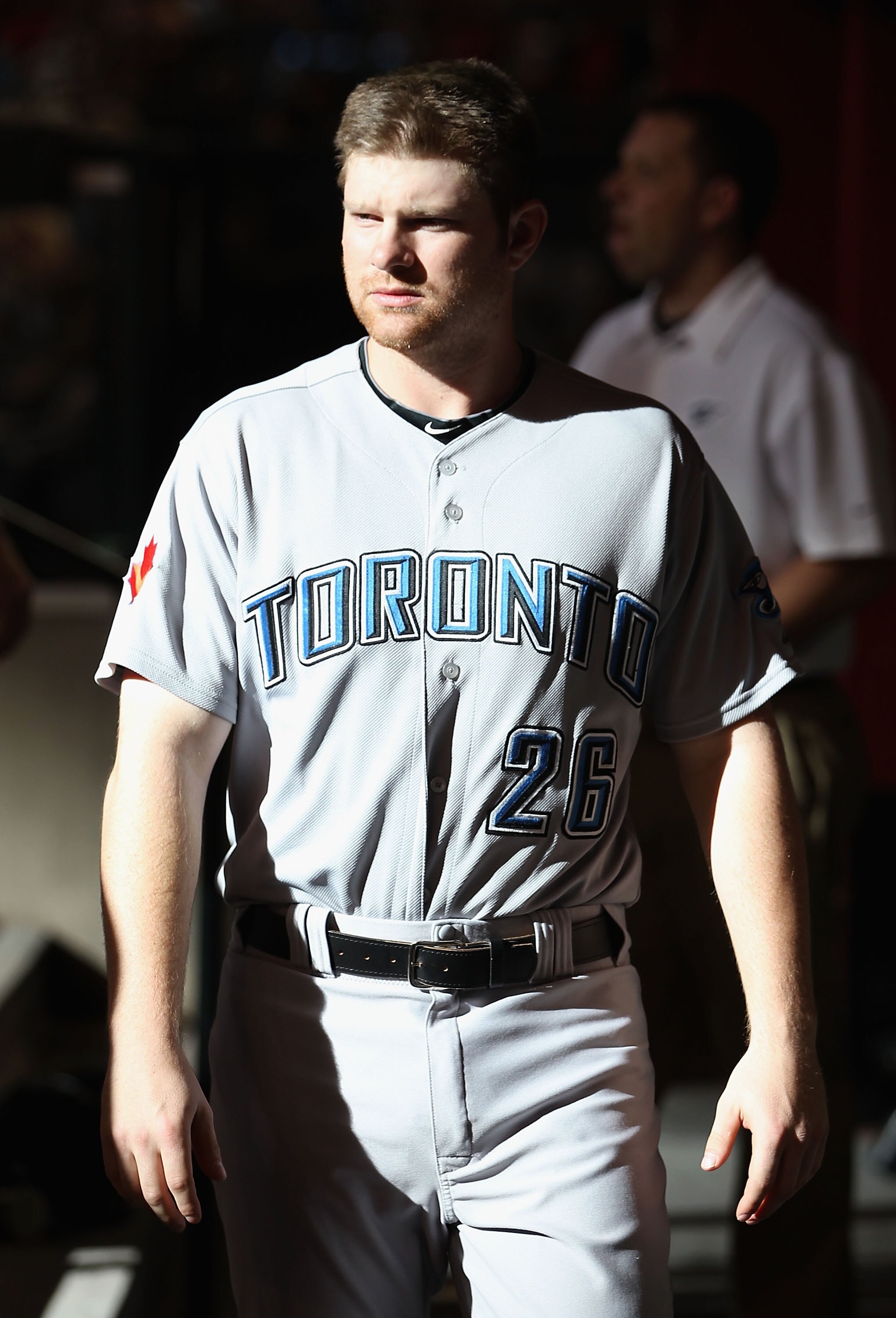 PHOENIX - MAY 22:  Adam Lind #26 of the Toronto Blue Jays walks in the dugout before the Major League Baseball game against the Arizona Diamondbacks at Chase Field on May 22, 2010 in Phoenix, Arizona. The Diamondbacks defeated the Blue Jays 8-5.  (Photo b