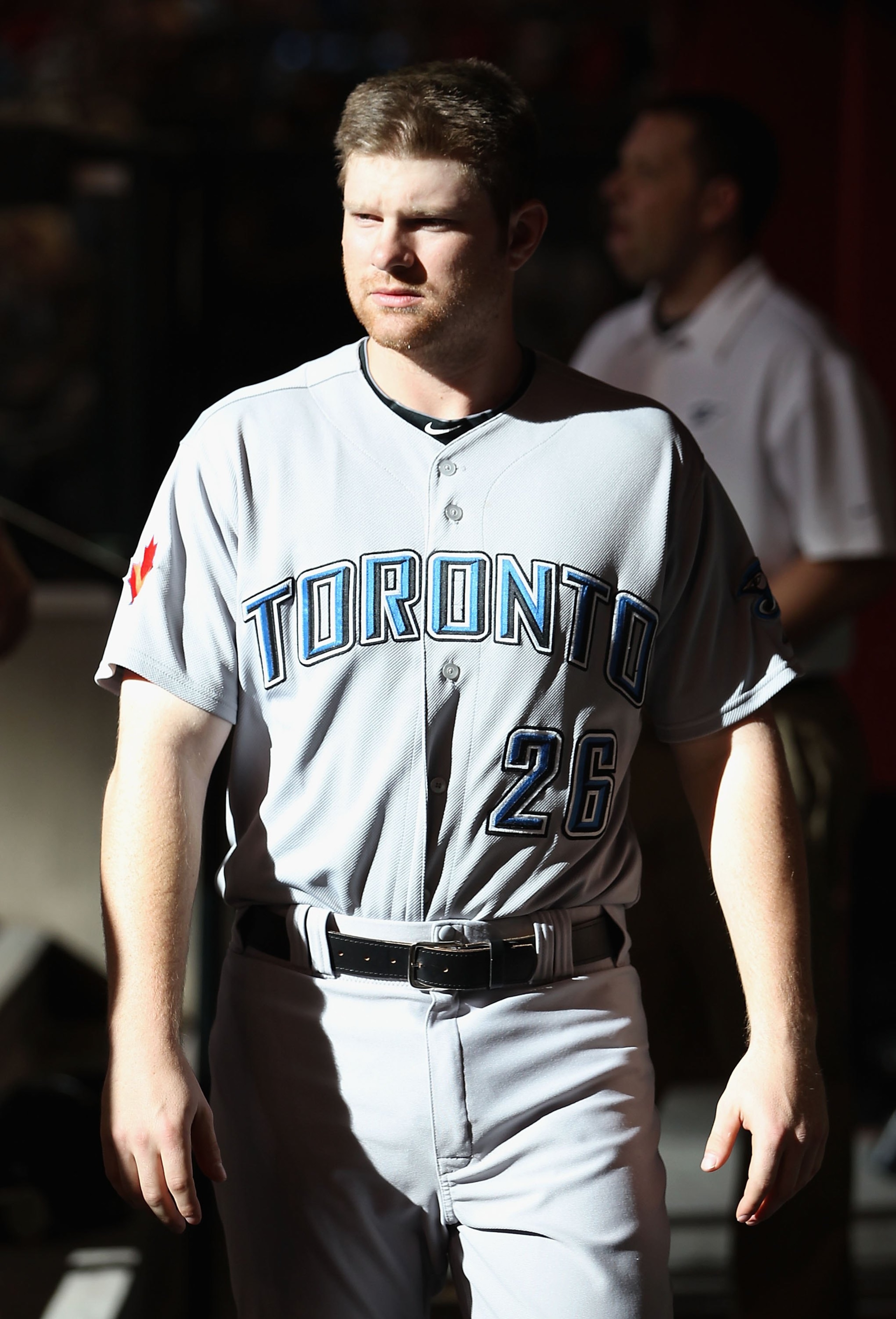 PHOENIX - MAY 22:  Adam Lind #26 of the Toronto Blue Jays walks in the dugout before the Major League Baseball game against the Arizona Diamondbacks at Chase Field on May 22, 2010 in Phoenix, Arizona. The Diamondbacks defeated the Blue Jays 8-5.  (Photo b