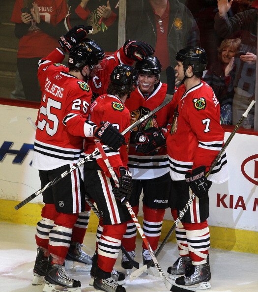 CHICAGO, IL - MARCH 23: Patrick Kane #88 of the Chicago Blackhawks is congratulated by (L-R) Viktor Stalberg #25, Jonathan Toews #19, Duncan Keith #2 and Brent Seabrook #7 after scoring a goal against the Florida Panthers at the United Center on March 23,