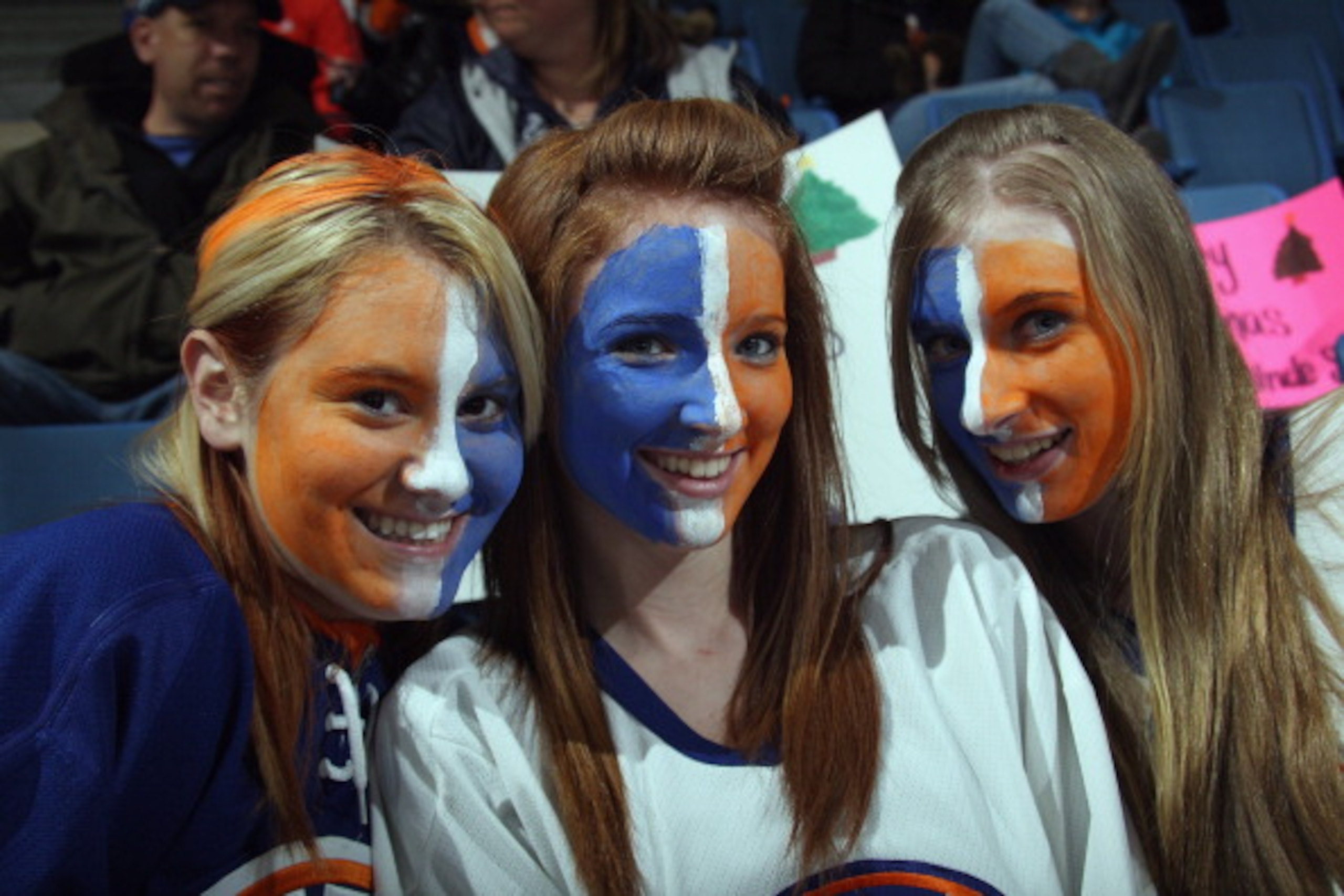 UNIONDALE, NY - DECEMBER 22: Fans of the New York Islanders show their colors during the game against the Tampa Bay Lightning at the Nassau Coliseum on December 22, 2010 in Uniondale, New York. (Photo by Bruce Bennett/Getty Images) UNIONDALE, NY - DECEMBER 22: Fans of the New York Islanders show their colors during the game against the Tampa Bay Lightning at the Nassau Coliseum on December 22, 2010 in Uniondale, New York. (Photo by Bruce Bennett/Getty Images)