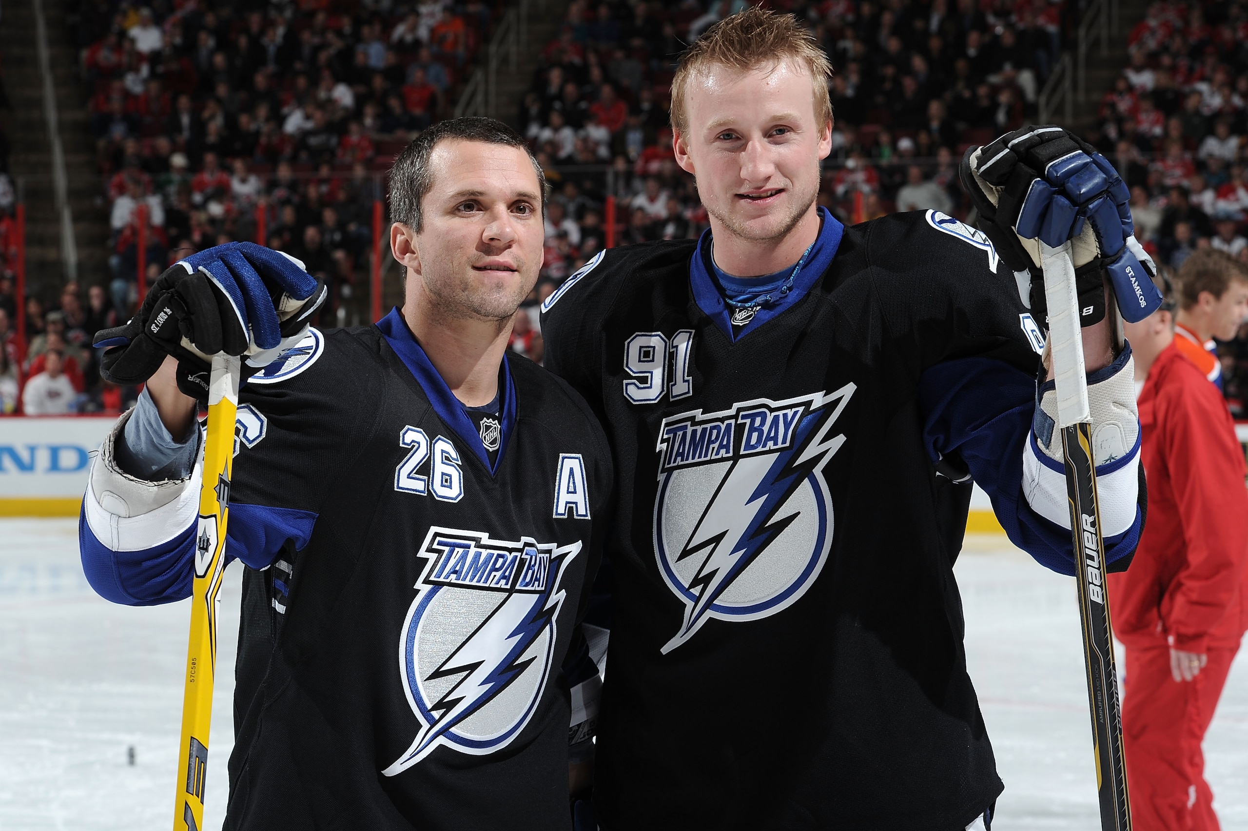 RALEIGH, NC - JANUARY 29:  Martin St. Louis #26 and Steven Stamkos #91 of the Tampa Bay Lightning look on during the Honda NHL SuperSkills competition part of 2011 NHL All-Star Weekend at the RBC Center on January 29, 2011 in Raleigh, North Carolina.  (Ph