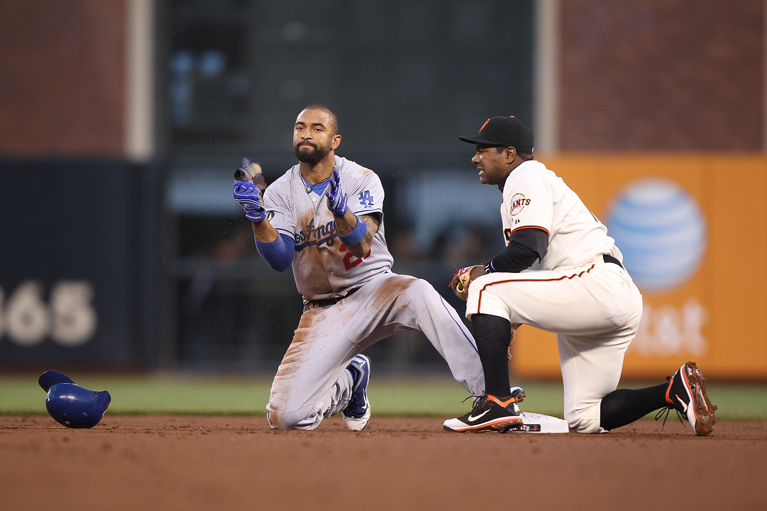 SAN FRANCISCO, CA - APRIL 11:  Matt Kemp #27 of the Los Angeles Dodgers celebrates after stealing second base past Miguel Tejada #10 of the San Francisco Giants in the second inning during an MLB game at AT&T Park on April 11, 2011 in San Francisco, Calif