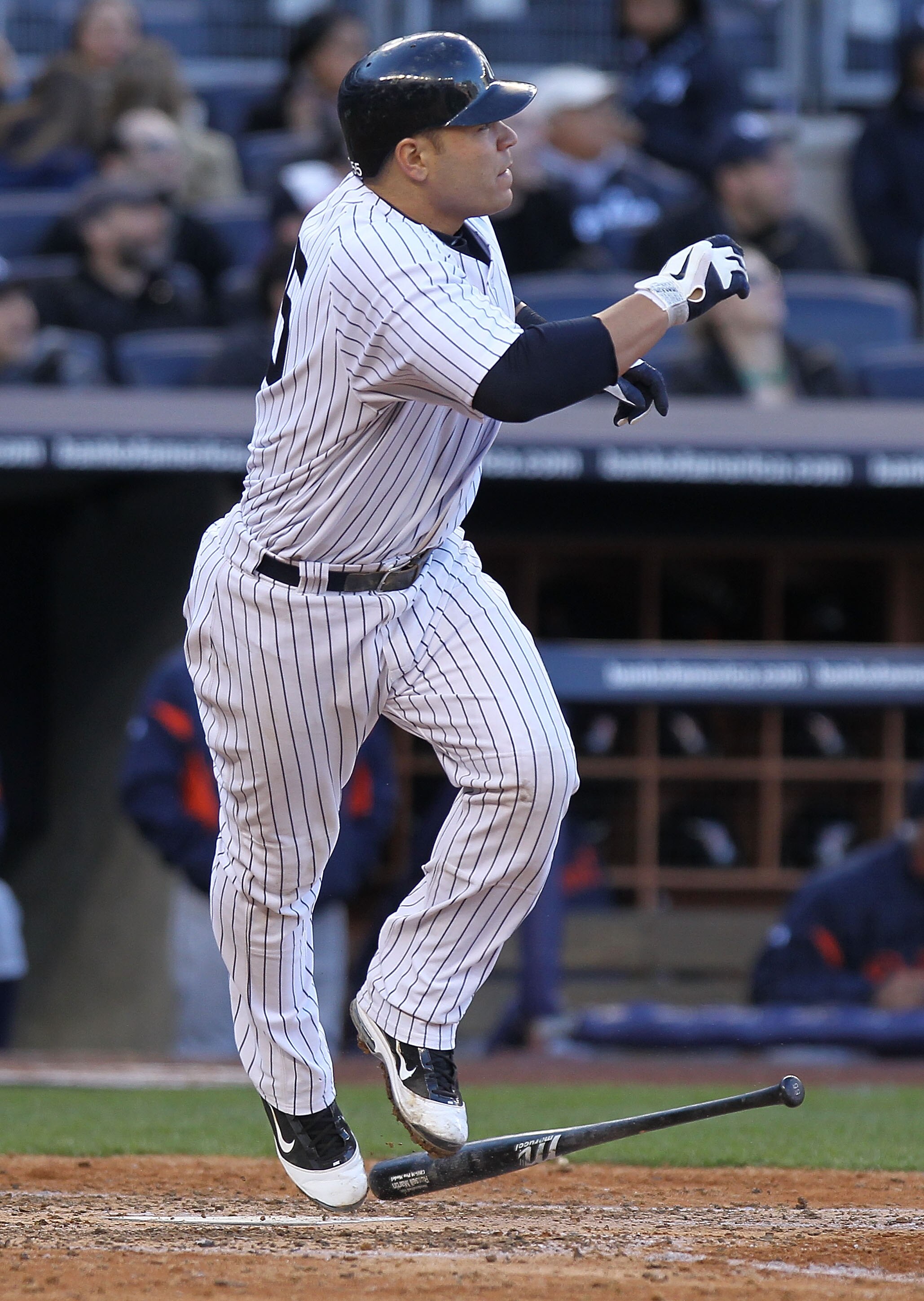 NEW YORK, NY - APRIL 02: Russell Martin #55 of the New York Yankees hits a 3 RBI homerun in the fifth inning against the Detroit Tigers at Yankee Stadium on April 2, 2011 in the Bronx borough of New York City. (Photo by Nick Laham/Getty Images)