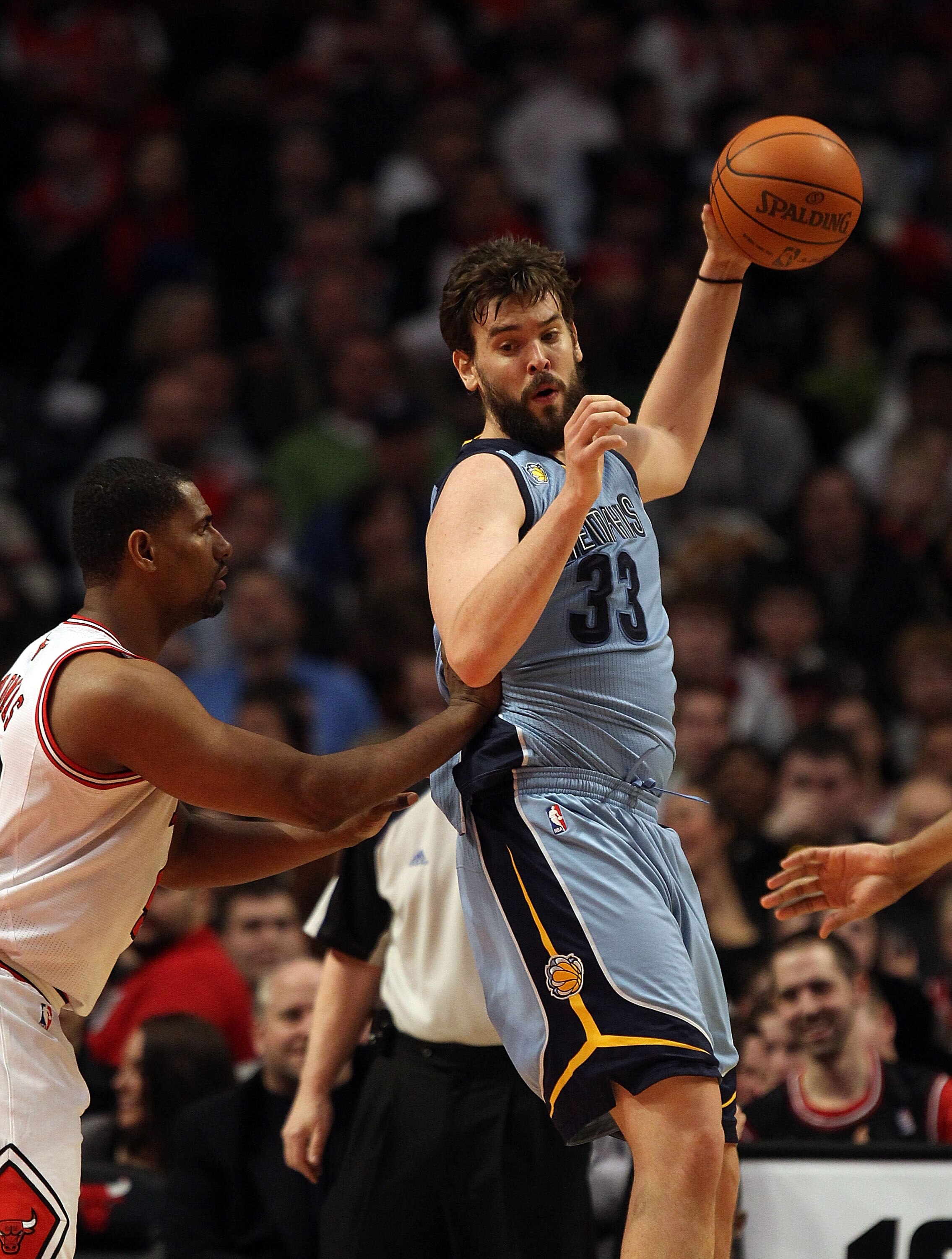 CHICAGO, IL - MARCH 25: Marc Gasol #33 of the Memphis Grizzlies grabs a pass under pressure from Kurt Thomas #40 of the Chicago Bulls at the United Center on March 25, 2011 in Chicago, Illinois. The Bulls defeated the Grizzlies 99-96. NOTE TO USER: User e