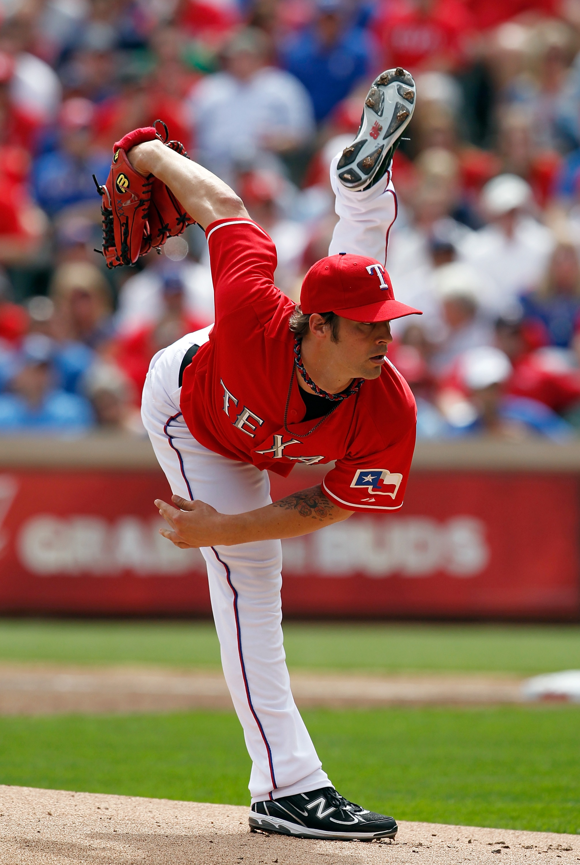 ARLINGTON, TX - APRIL 01: Starting pitcher C.J. Wilson, #36 of the Texas Rangers, throws against the Boston Red Sox on Opening Day at Rangers Ballpark in Arlington on April 1, 2011 in Arlington, Texas. (Photo by Tom Pennington/Getty Images) ARLINGTON, TX - APRIL 01: Starting pitcher C.J. Wilson, #36 of the Texas Rangers, throws against the Boston Red Sox on Opening Day at Rangers Ballpark in Arlington on April 1, 2011 in Arlington, Texas. (Photo by Tom Pennington/Getty Images)