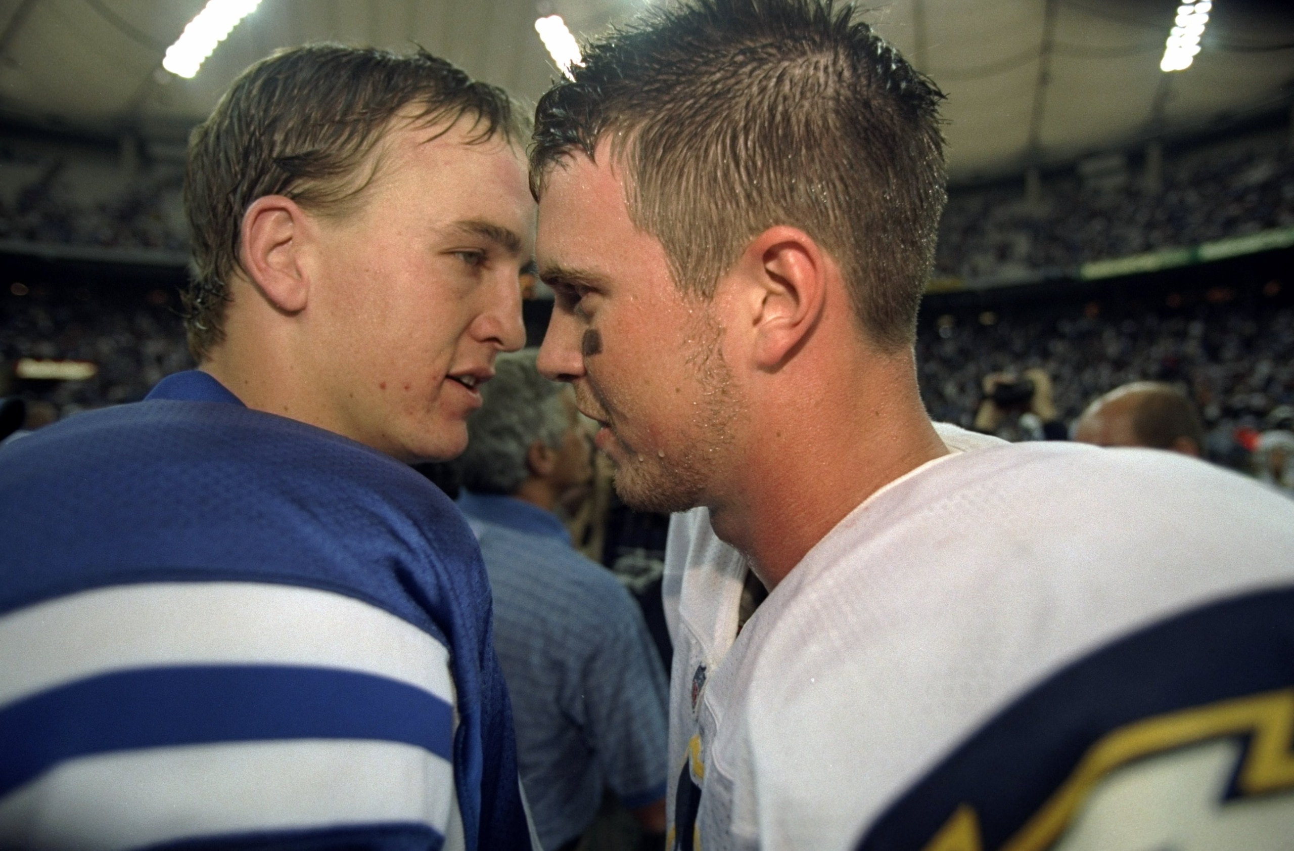 4 Oct 1998:  Quarterback Ryan Leaf #16 (R) of the San Diego Chargers and quarterback Peyton Manning #18 (L) of the Indianapolis Colts converse following a game at the RCA Dome in Indianapolis, Indiana. The Colts defeated the Chargers 17-12.
