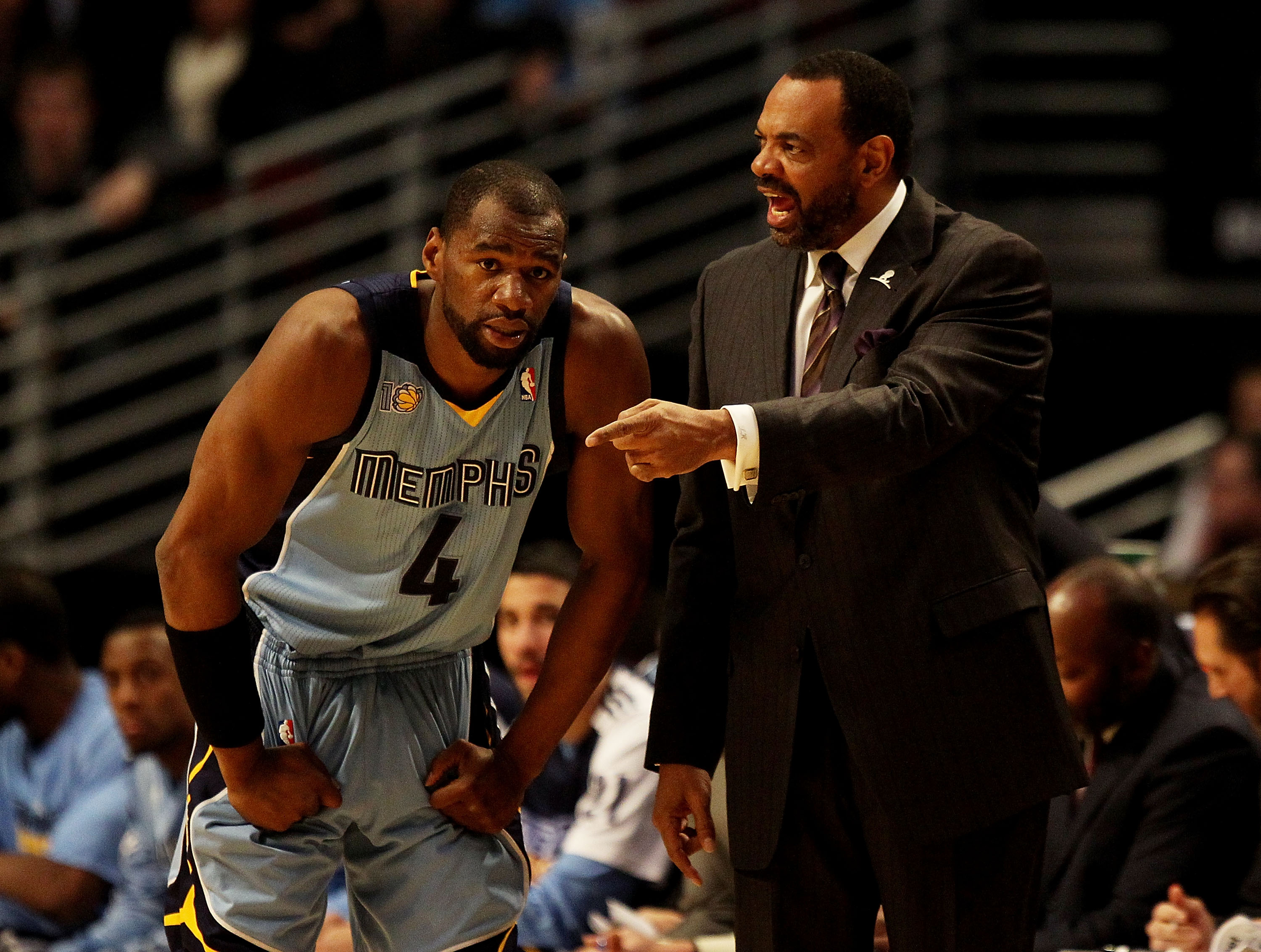 CHICAGO, IL - MARCH 25: Head coach Lionel Hollins  of the Memphis Grizzlies gives instructions to Sam Young #4 during a game against the Chicago Bulls at the United Center on March 25, 2011 in Chicago, Illinois. The Bulls defeated the Grizzlies 99-96. NOT
