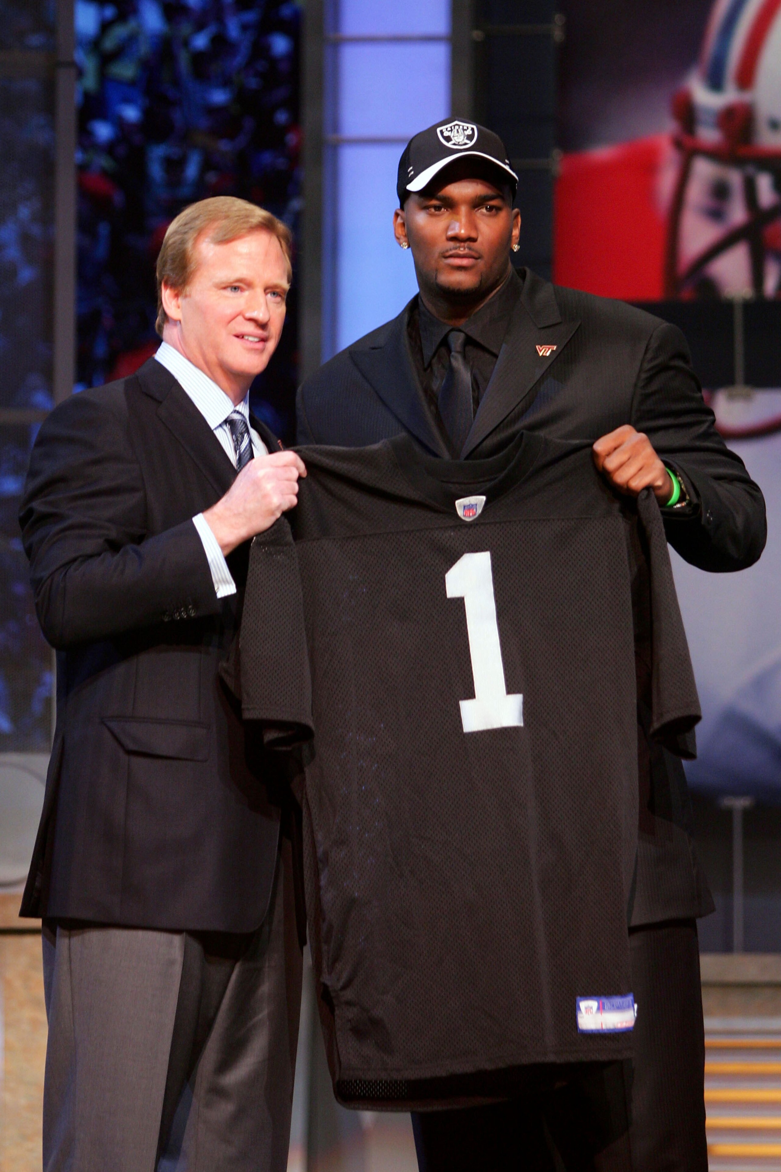 NEW YORK - APRIL 28:  Quarterback JaMarcus Russell of Louisiana State University poses for a photo with NFL Commisioner Roger Goodell after being drafted first overall by the Oakland Raiders during the 2007 NFL Draft on April 28, 2007 at Radio City Music