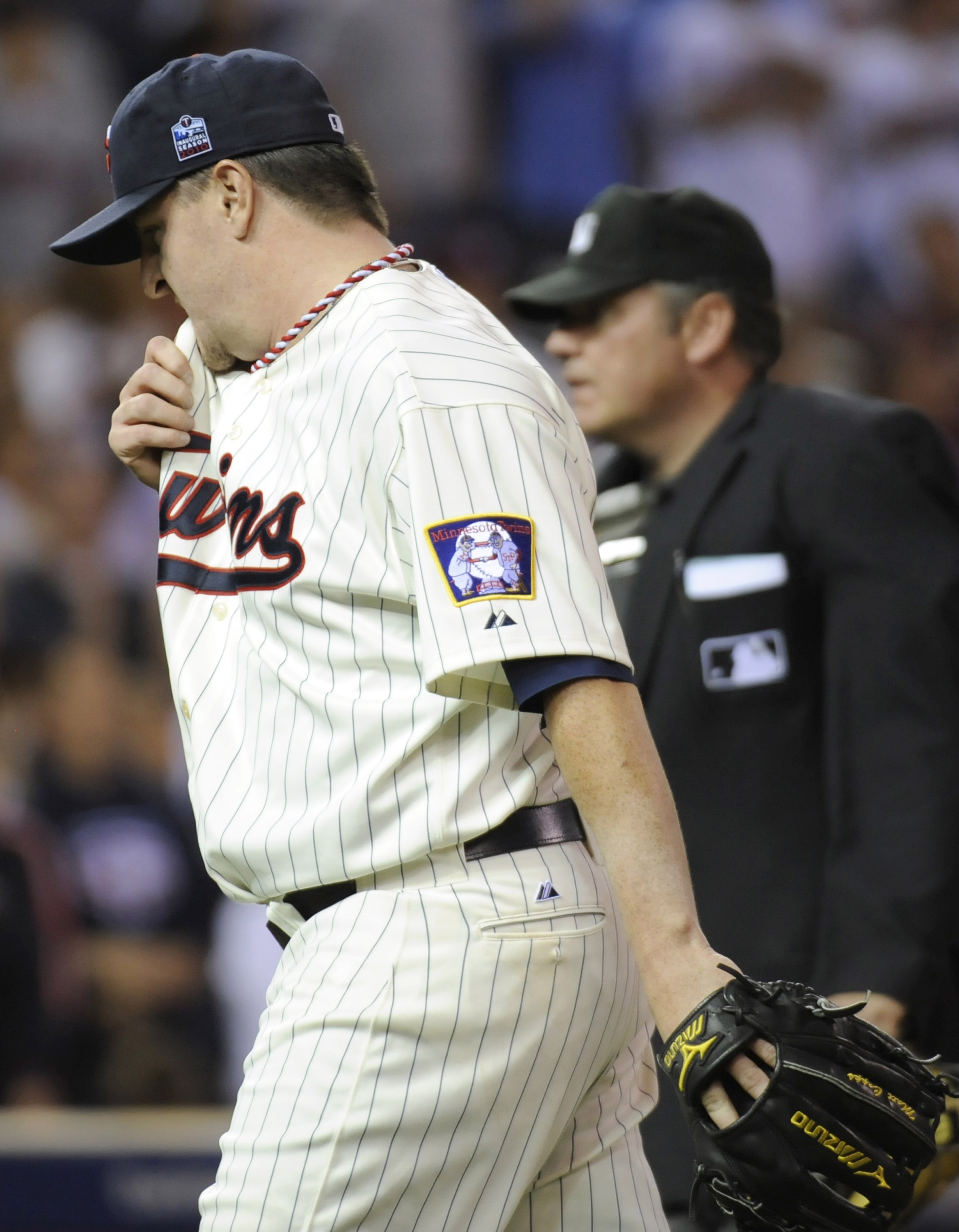 MINNEAPOLIS, MN - OCTOBER 7: Matt Capps #55 of the Minnesota Twins walks to the dugout following the top of the ninth inning during game two of the ALDS game against the New York Yankees on October 7, 2010 at Target Field in Minneapolis, Minnesota. (Photo MINNEAPOLIS, MN - OCTOBER 7: Matt Capps #55 of the Minnesota Twins walks to the dugout following the top of the ninth inning during game two of the ALDS game against the New York Yankees on October 7, 2010 at Target Field in Minneapolis, Minnesota. (Photo