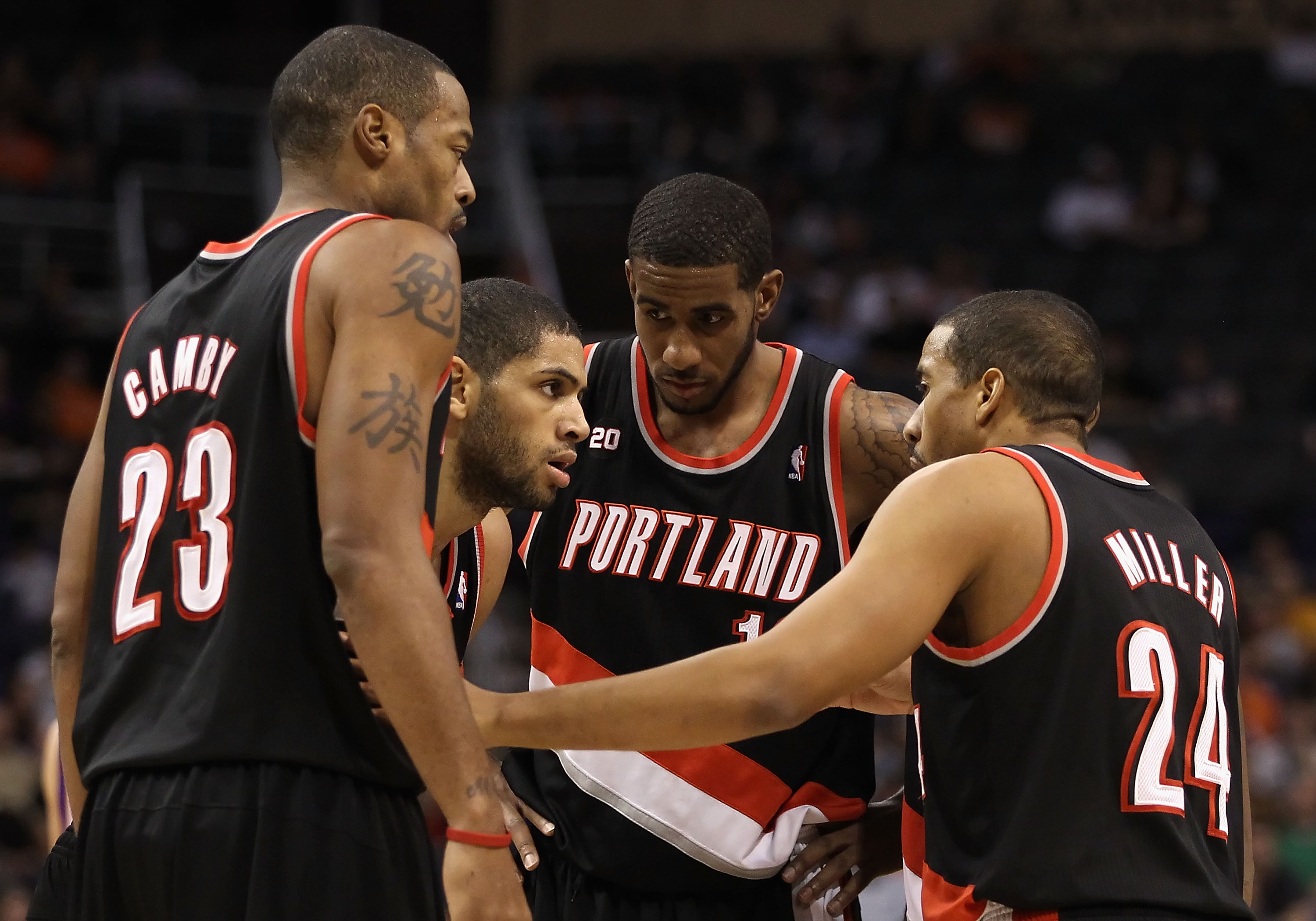 PHOENIX, AZ - JANUARY 14: (L-R) Marcus Camby #23, Nicolas Batum #88, LaMarcus Aldridge #12 and Andre Miller #24 of the Portland Trail Blazers huddle up during the NBA game against the Phoenix Suns at US Airways Center on January 14, 2011 in Phoenix, Arizo