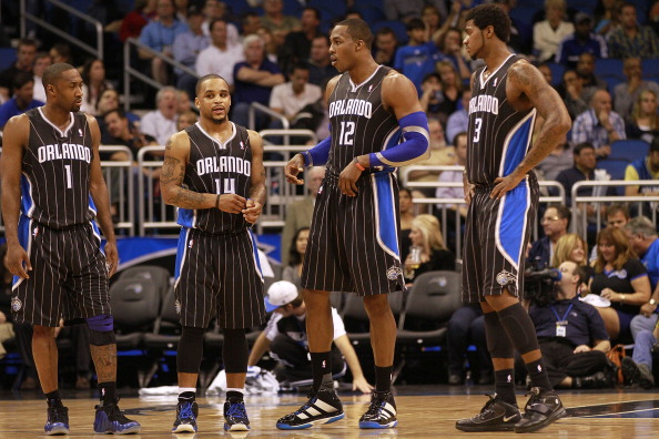 ORLANDO, FL - FEBRUARY 03: (L-R) Guard Gilbert Arenas #1, Guard Jameer Nelson #14, Center Dwight Howard #12 and Forward Earl Clark #3 of the Orlando Magic line against the Miami Heat at Amway Arena on February 3, 2011 in Orlando, Florida. NOTE TO USER: Us
