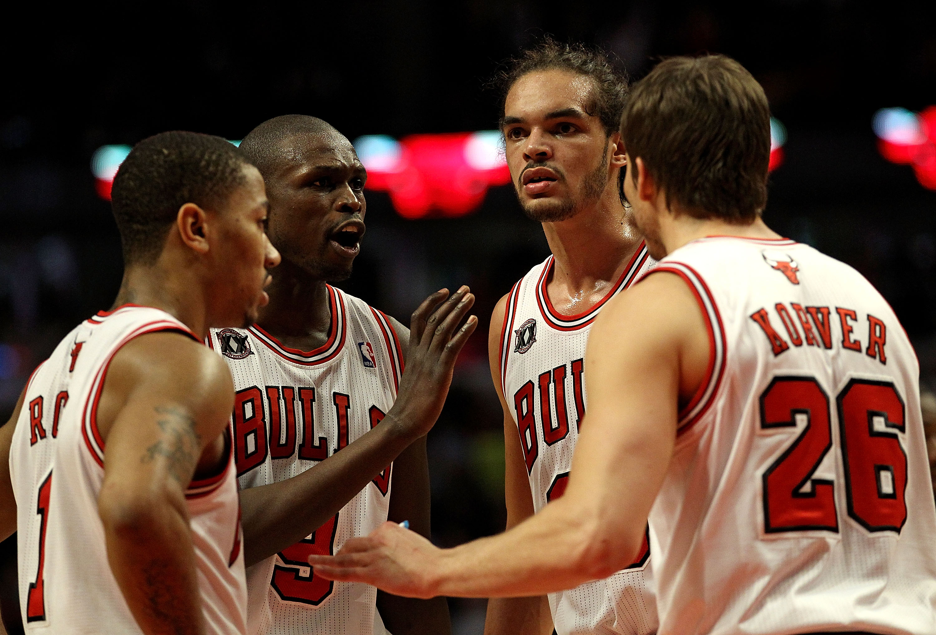 CHICAGO, IL - MARCH 25: (L-R) Derrick Rose #1, Loul Deng #9, Joakim Noah #13 and Kyle Korver #26 of the Chicago Bulls gather to talk during a game against the Memphis Grizzlies at the United Center on March 25, 2011 in Chicago, Illinois. The Bulls defeate