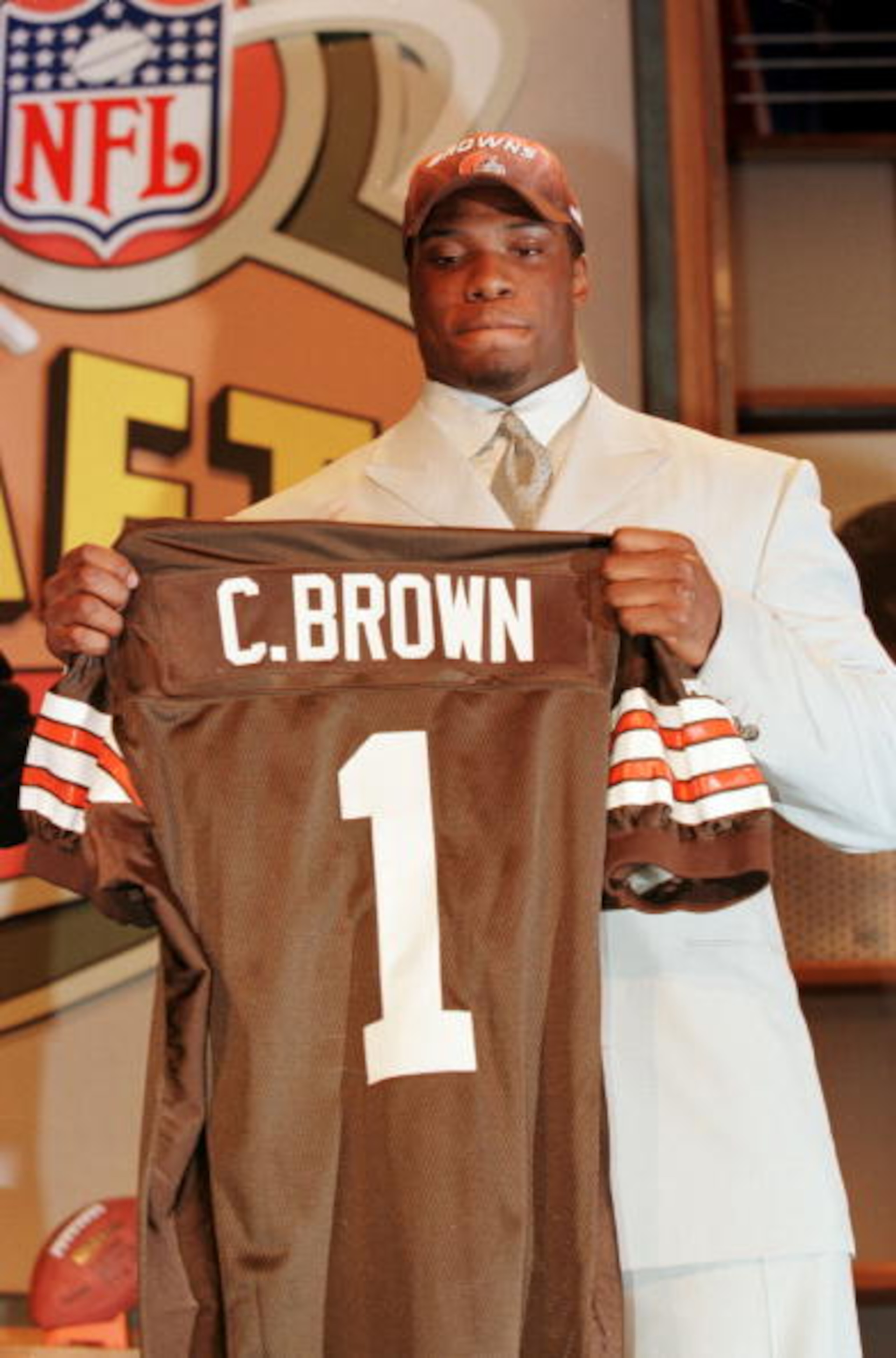 15 Apr 2000:   Courtney Brown holds up a Brown''s jersey after Cleveland made him the number one pick in the 2000 NFL Draft at the Paramount Theater at Madison Square Garden in New York, New York. Mandatory Credit: M. David Leeds/ALLSPORT