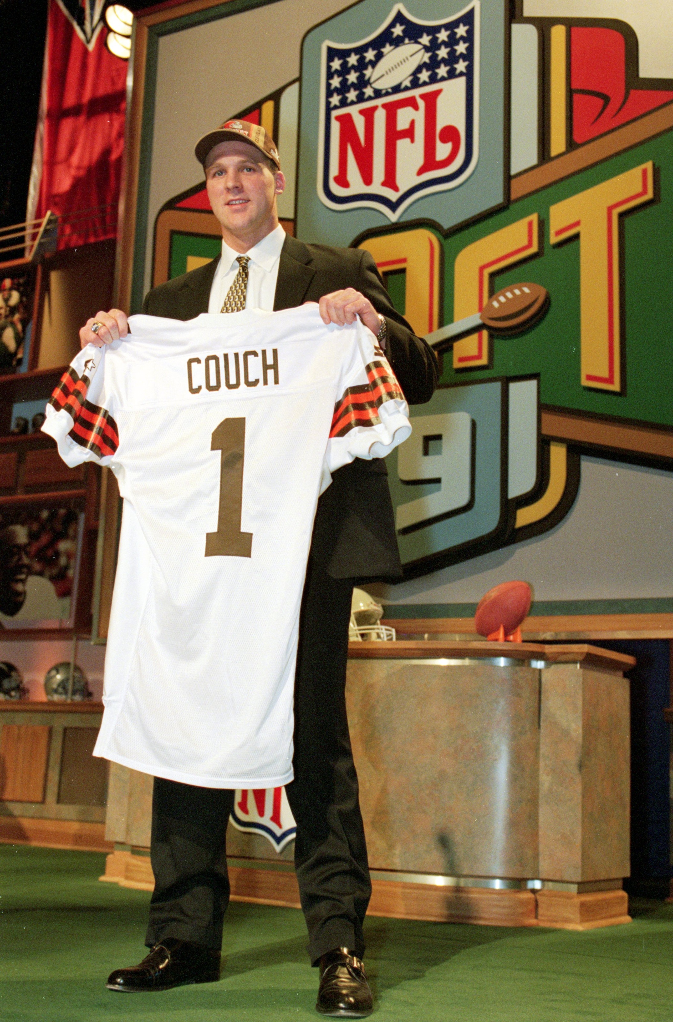 17 Apr 1999:  #1 pick Tim Couch of the Cleveland Browns holds up his Browns jersey during the NFL Draft at Madison Square Garden in New York, New York. Mandatory Credit: Ezra O. Shaw  /Allsport