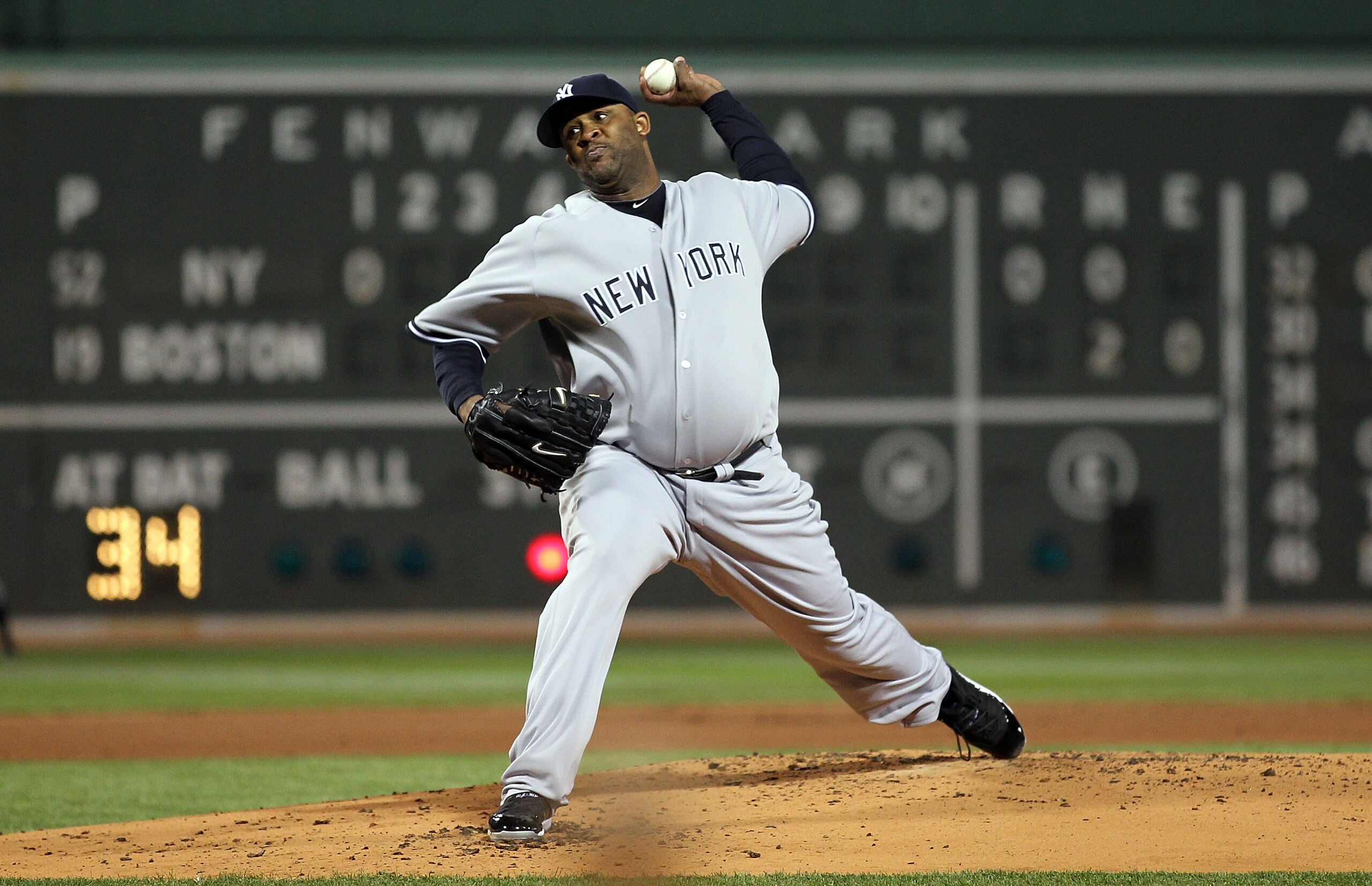 BOSTON, MA - APRIL 10:  CC Sabathia #52 of the New York Yankees throws against the Boston Red Sox at Fenway Park April 10, 2011 in Boston, Massachusetts. (Photo by Jim Rogash/Getty Images)