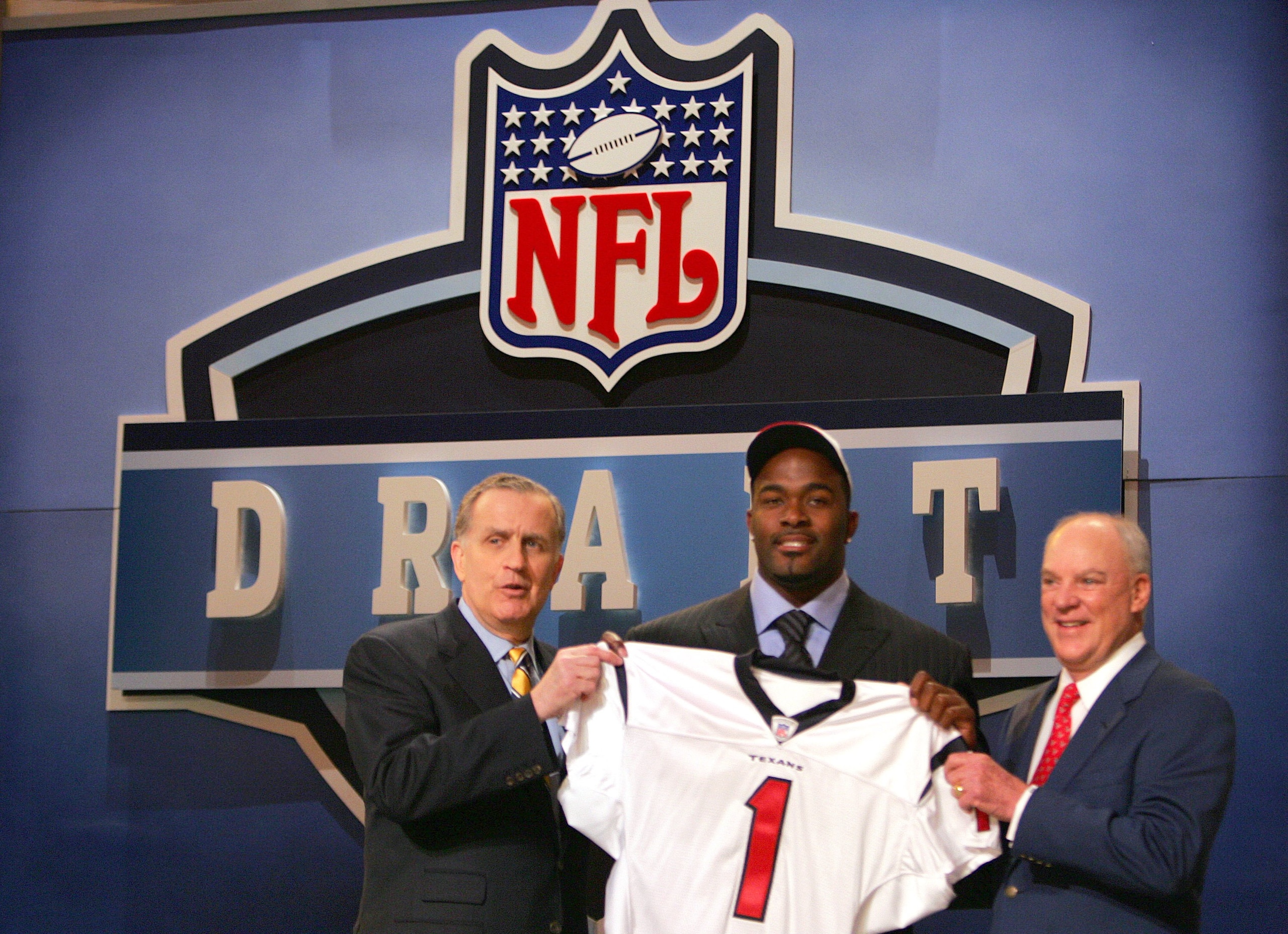 NEW YORK - APRIL 29: Mario Williams (C) of North Carolina State poses with NFL Commissioner Paul Tagliabue (L) and owner of the Houston Texas Bob McNair after Williams was drafted first overall by the Houston Texans during the 2006 NFL Draft on April 29, 
