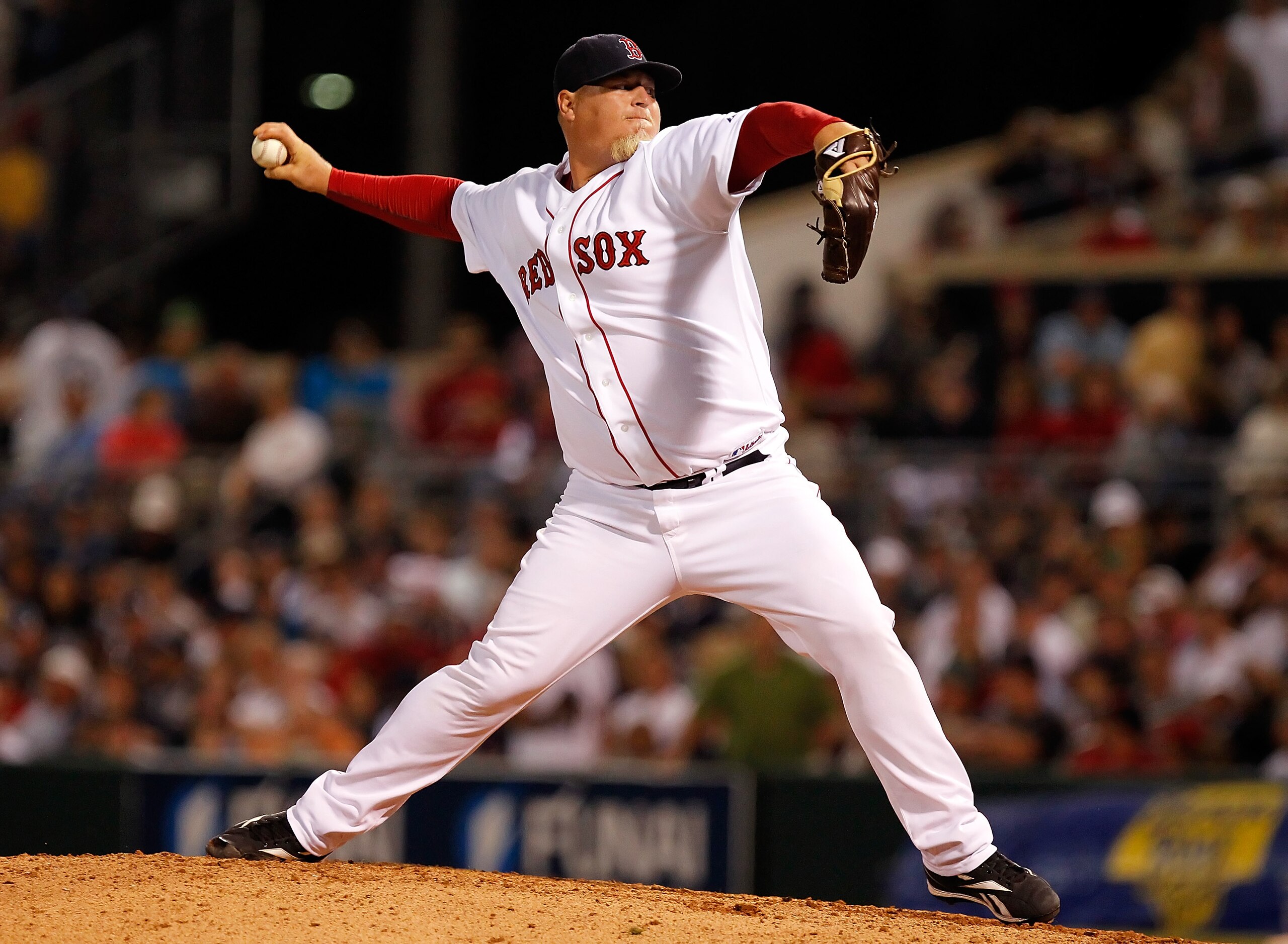 FORT MYERS, FL - MARCH 14:  Pitcher Bobby Jenks #52 of the Boston Red Sox pitches against the New York Yankees during a Grapefruit League Spring Training Game at City of Palms Park on March 14, 2011 in Fort Myers, Florida.  (Photo by J. Meric/Getty Images