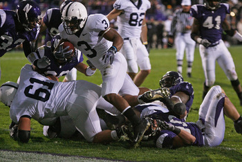 EVANSTON, IL - OCTOBER 31: Brandon Beachum #3 of the Penn State Nittany Lions hops over teammate Stefen Wisniewski #61 and Brian Peters #10 of the Northwestern Wildcats to score a touchdown at Ryan Field on October 31, 2009 in Evanston, Illinois. Penn Sta